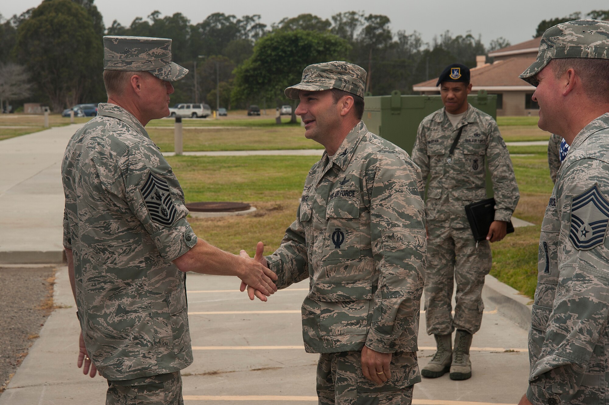 Col Max Lantz, 381st Training Group commander, greets Chief Master Sgt. of the Air Force, James A. Cody, prior to his tour of the 381st TRG campus, July 8, 2014, Vandenberg Air Force Base, Calif. During his visit with the 381st TRG, Cody had the opportunity to interact with enlisted students currently in training as space operators and missile maintainers. (U.S. Air Force photo by Michael Peterson/Released)