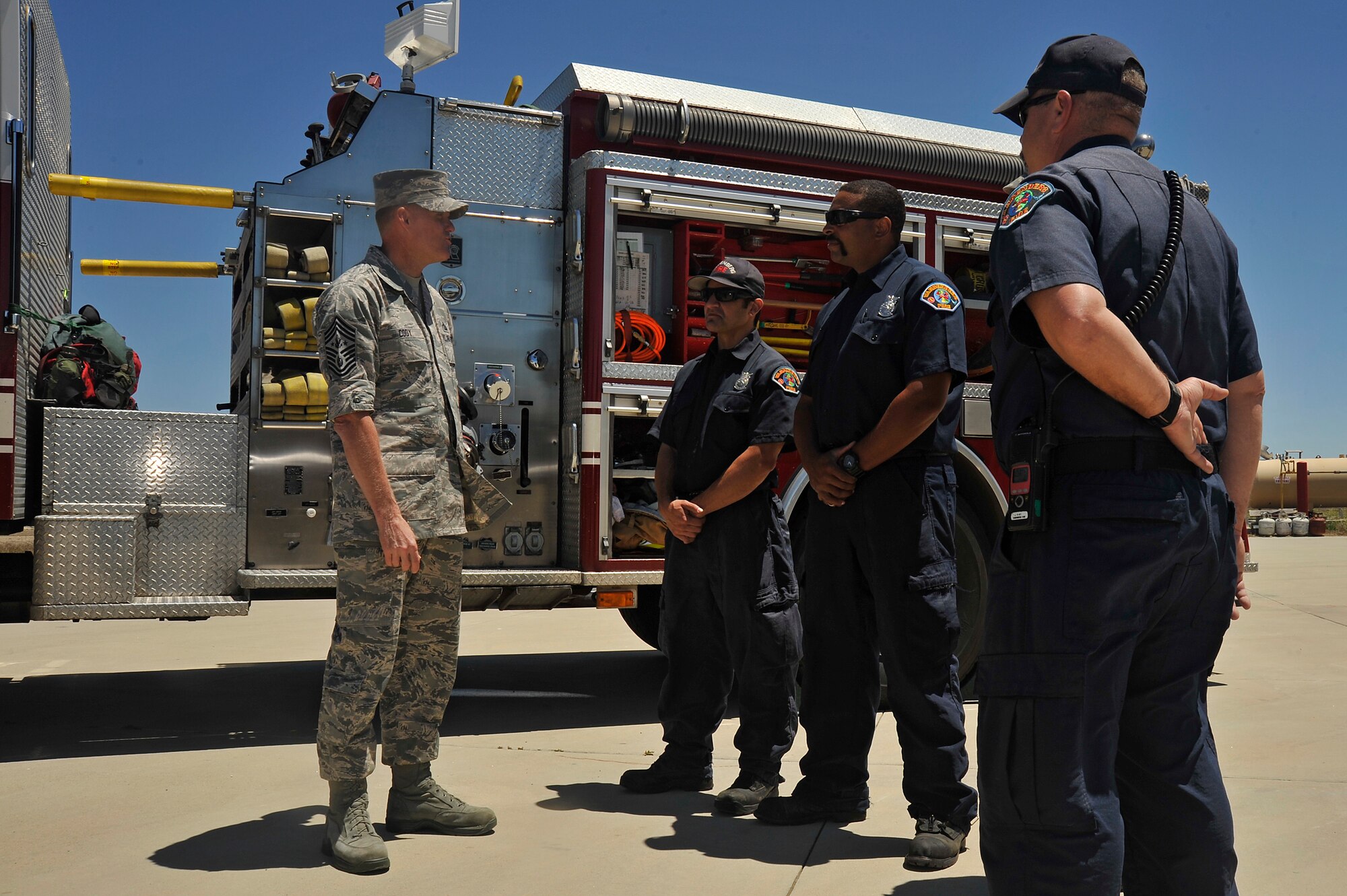 Chief Master Sgt. of the Air Force, James A. Cody, speaks with Vandenberg firefighters during a tour that showcased the 30th Mission Support Group capabilities, July 8, 2014, Vandenberg Air Force Base, Calif. During the tour Cody also had the opportunity to meet the Hot Shots, Vandenberg's team of firefighters, specializing in fighting wildfires. (U.S. Air Force photo by Michael Peterson/Released)