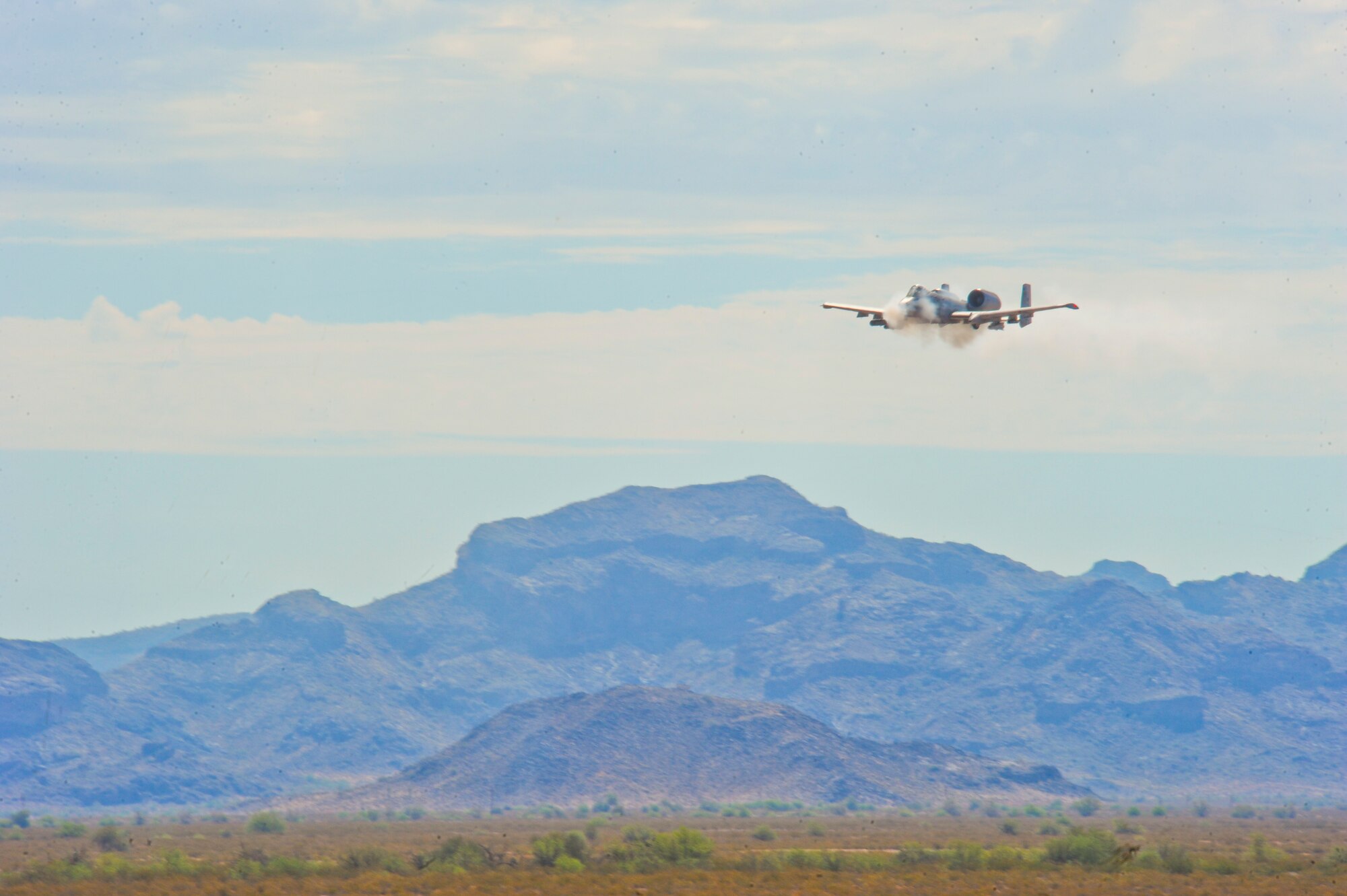 U.S. Air Force A-10 Thunderbolt II strafes during the 2014 Hawgsmoke Competition at Barry M. Goldwater Range Two in Tucson, Ariz., July 10, 2014. This year’s Hawgsmoke competition focused on forward firing. The participants competed in high, medium, and low-angle strafes. (U.S. Air Force photo by Airman 1st Class Sivan Veazie/Released)