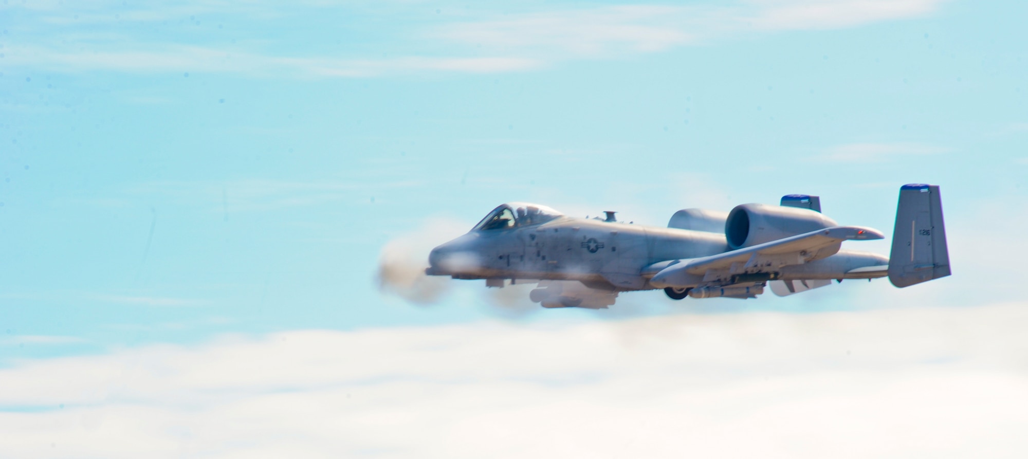 U.S. Air Force A-10 Thunderbolt II strafes during the 2014 Hawgsmoke Competition at Barry M. Goldwater Range Two in Tucson, Ariz., July 10, 2014. Hawgsmoke is a biennial worldwide A-10 bombing, missile, and tactical gunnery competition, which was derived from the discontinued “Gunsmoke” Air Force Worldwide Gunnery Competition. (U.S. Air Force photo by Airman 1st Class Sivan Veazie/Released)