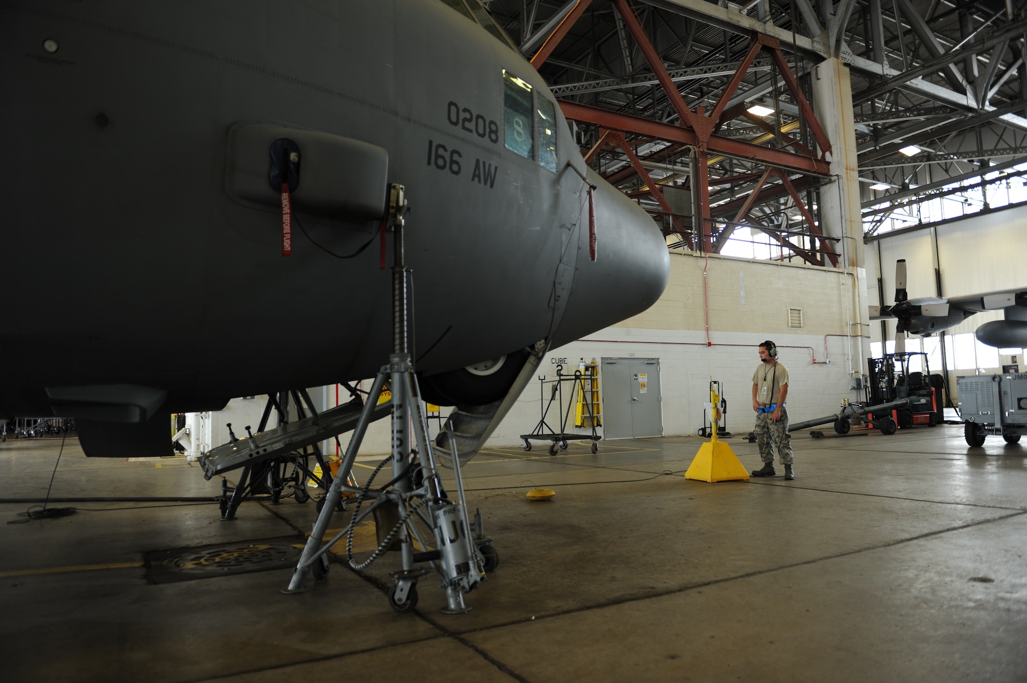 Tech. Sgt. Shaun Shurkin a 314th Aircraft Maintenance Squadron crew chief, observes a landing gear check on a C-130H June 26, 2014, at Little Rock Air Force Base, Ark. The 314th AMXS partners with the 19th MXS to accomplish back shop maintenance such as hydraulics maintenance on C-130 brakes, aerospace ground equipment delivery and even rebuilding engines. (U.S. photo by Airman 1st Class Cliffton Dolezal)