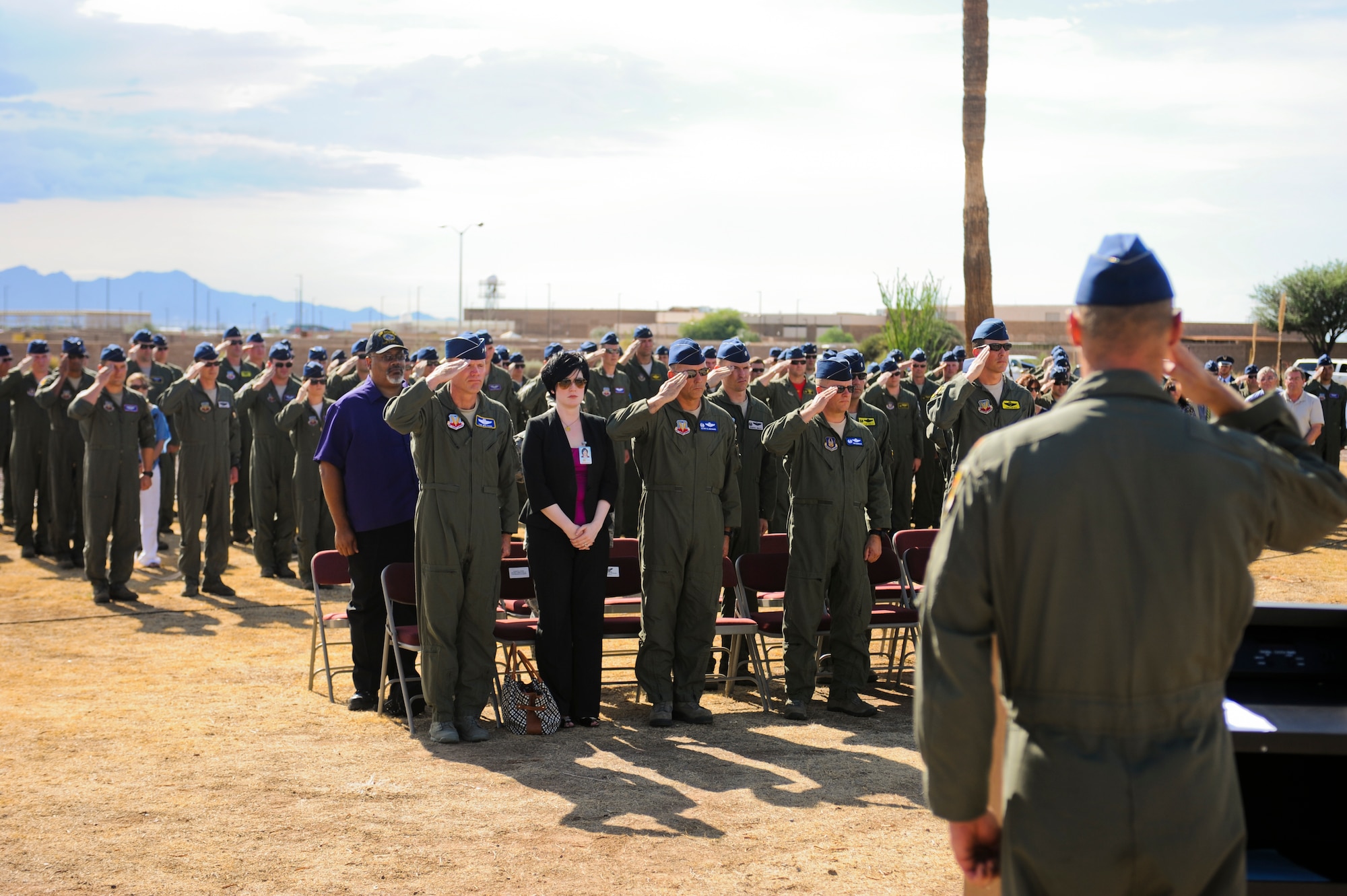 U.S. Air Force Airmen present arms in honor of fallen A-10 pilots during the opening ceremony of the 2014 Hawgsmoke Competition at Davis-Monthan Air Force Base, Ariz., July 9, 2014.  In remembrance of the fallen pilots, the participants of the 2014 Hawgsmoke Competition also held a moment of silence, took a traditional shot of whiskey and smashed the shot glass. (U.S. Air Force photo by Airman 1st Class Sivan Veazie/Released)