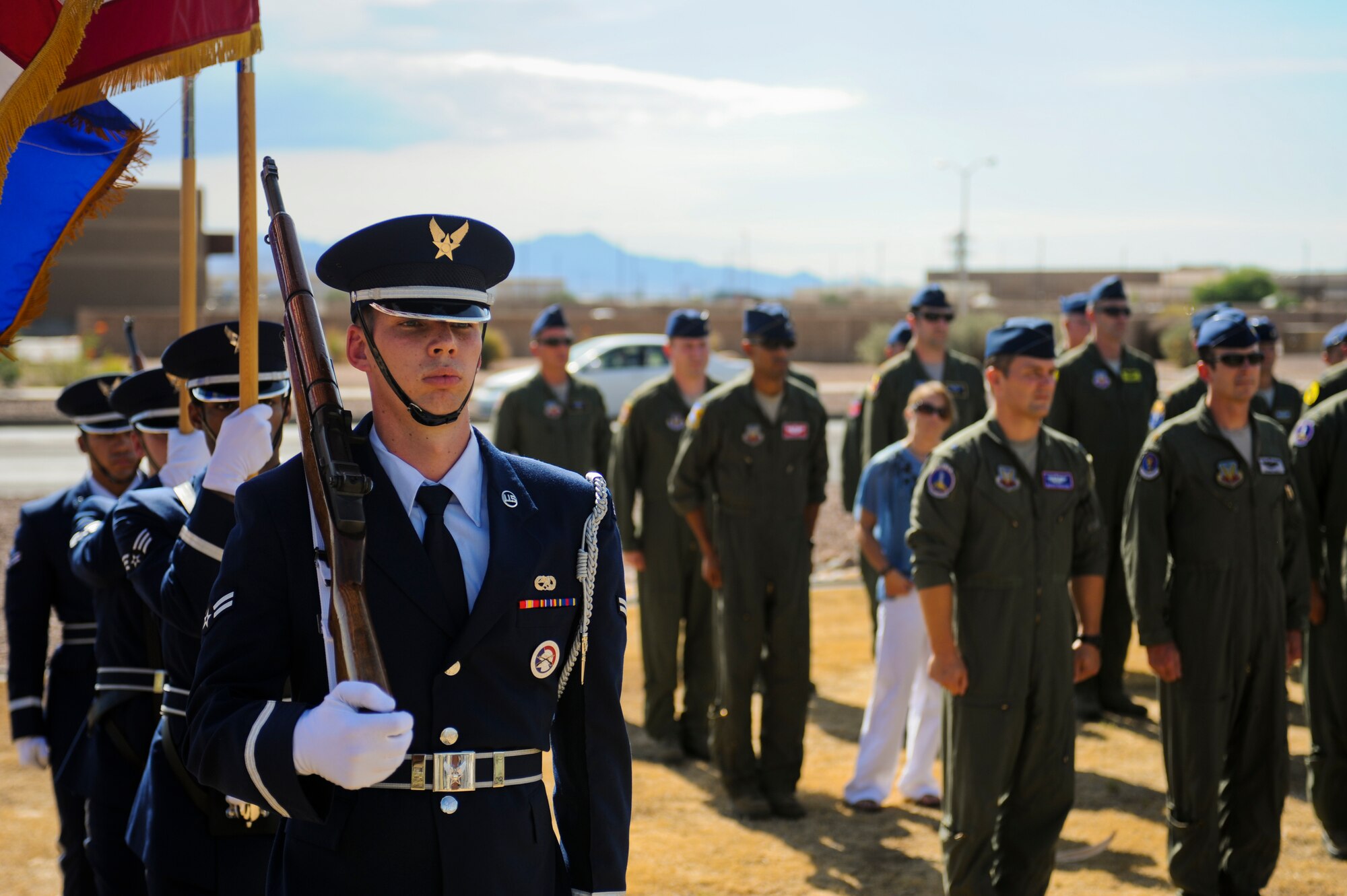 U.S. Air Force Honor Guardsmen prepare to present the colors during the opening ceremony of the 2014 Hawgsmoke Competition at Davis-Monthan Air Force Base, Ariz., July 9, 2014. Hawgsmoke is a biennial U.S. Air Force bombing, missile, and tactical gunnery competition for A-10 Thunderbolt II units. (U.S. Air Force photo by Airman 1st Class Sivan Veazie/Released)