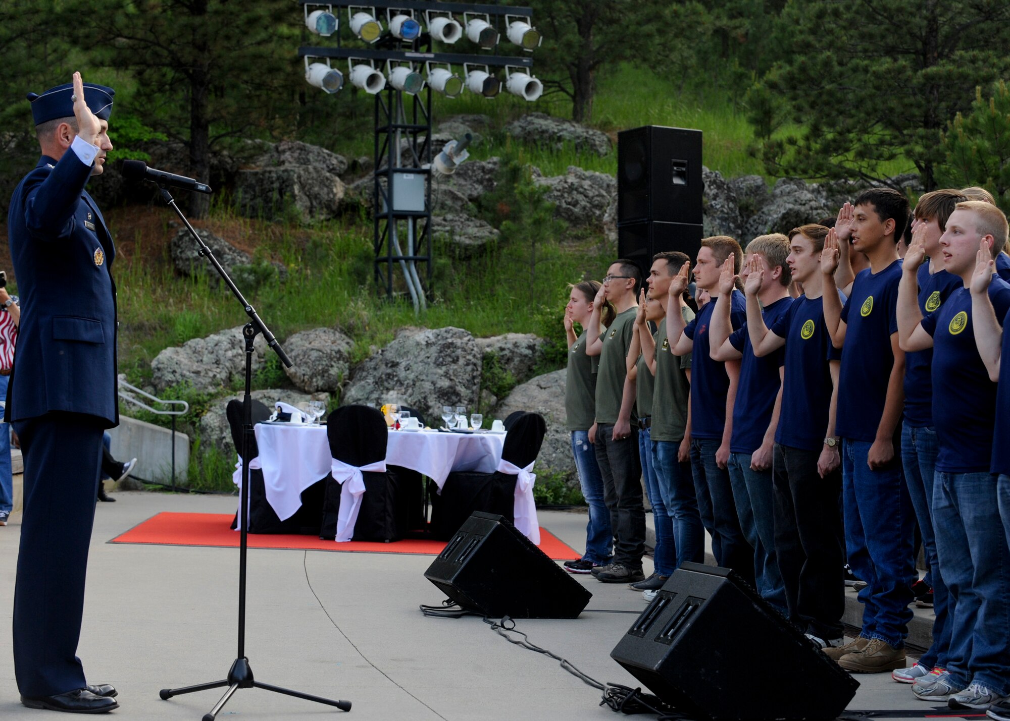 Col. Kevin Kennedy, 28th Bomb Wing commander, administers the oath of enlistment to U.S. military recruits from each branch of service at Mount Rushmore National Memorial in South Dakota, July 3, 2014. Each servicemember must take an oath of enlistment ushering them into military service.  (U.S. Air Force photo by Senior Airman Anania Tekurio/Released)
