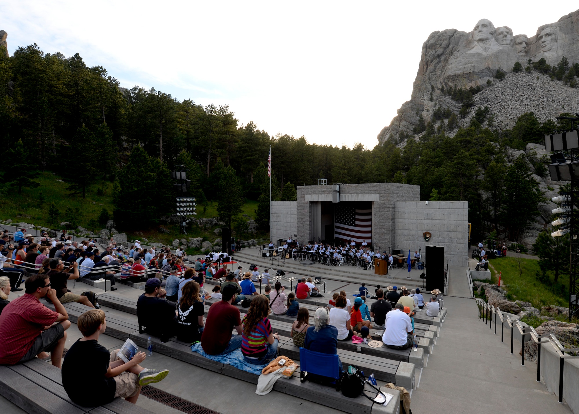 Visitors from around the world attend an Independence Day event at Mount Rushmore National Memorial in South Dakota, July 3, 2014. The event included patriotic themed music played by the U.S. Air Force Academy Concert Band, an enlistment oath ceremony conducted by Col. Kevin Kennedy, 28th Bomb Wing commander, and a flag folding ceremony performed by the Ellsworth Air Force Base Honor Guard. (U.S. Air Force photo by Senior Airman Anania Tekurio/Released)