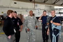 Dawson L. Frank, San Antonio International Airport interim airport emergency coordinator, Ryan Edwards, City of San Antonio firefighter, Master Sgt. Darnell Walls, the Joint Base San Antonio Fire Department assistant chief, Jerry Knopf and Tim Hagan, JBSA-Randolph firefighters wait to begin training July 9, 2014 at JBSA-Randolph. JBSA-Randolph firefighters trained City of San Antonio firefighters how to safely extricate pilots from a T-6 Texan II. The familiarization training is intended to bring firefighters together to prepare for emergencies. (U.S. Air Force photos by A1C Stormy D. Archer/Released)