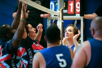 Melissa Garcia, right, follows the volleyball July 9, 2014, during the 2014 Wounded Warrior Summer Invitational Adaptive Sports Tournament at the Rambler Fitness Center at Joint Base San Antonio-Randolph, Texas. The event features 100 wounded warriors from both the U.S. and the United Kingdom. The event is leading up to two other events beginning this September, which are the Warrior Games being held in Colorado Springs, Colorado, and the Invictus Games being held in the U.K. Garcia is an Air Force wounded warrior. The three-day event included skill development and tournament competition in wheelchair basketball and sitting volleyball for the wounded warriors from the U.S. Air Force, Army, Marine Corps and Great Britain. (U.S. Air Force photo/Desiree N. Palacios)