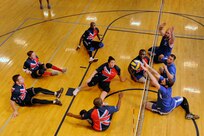The Air Force team scrimmages the United Kingdom team July 9, 2014, during the 2014 Wounded Warrior Summer Invitational Adaptive Sports Tournament at the Rambler Fitness Center at Joint Base San Antonio-Randolph, Texas. The event features 100 wounded warriors from both the U.S. and the United Kingdom. The event is leading up to two other events beginning this September, which are the Warrior Games being held in Colorado Springs, Colorado, and the Invictus Games being held in the U.K.  The three-day event included skill development and tournament competition in wheelchair basketball and sitting volleyball for the wounded warriors from the U.S. Air Force, Army, Marine Corps and Great Britain. (U.S. Air Force photo/Desiree N. Palacios)