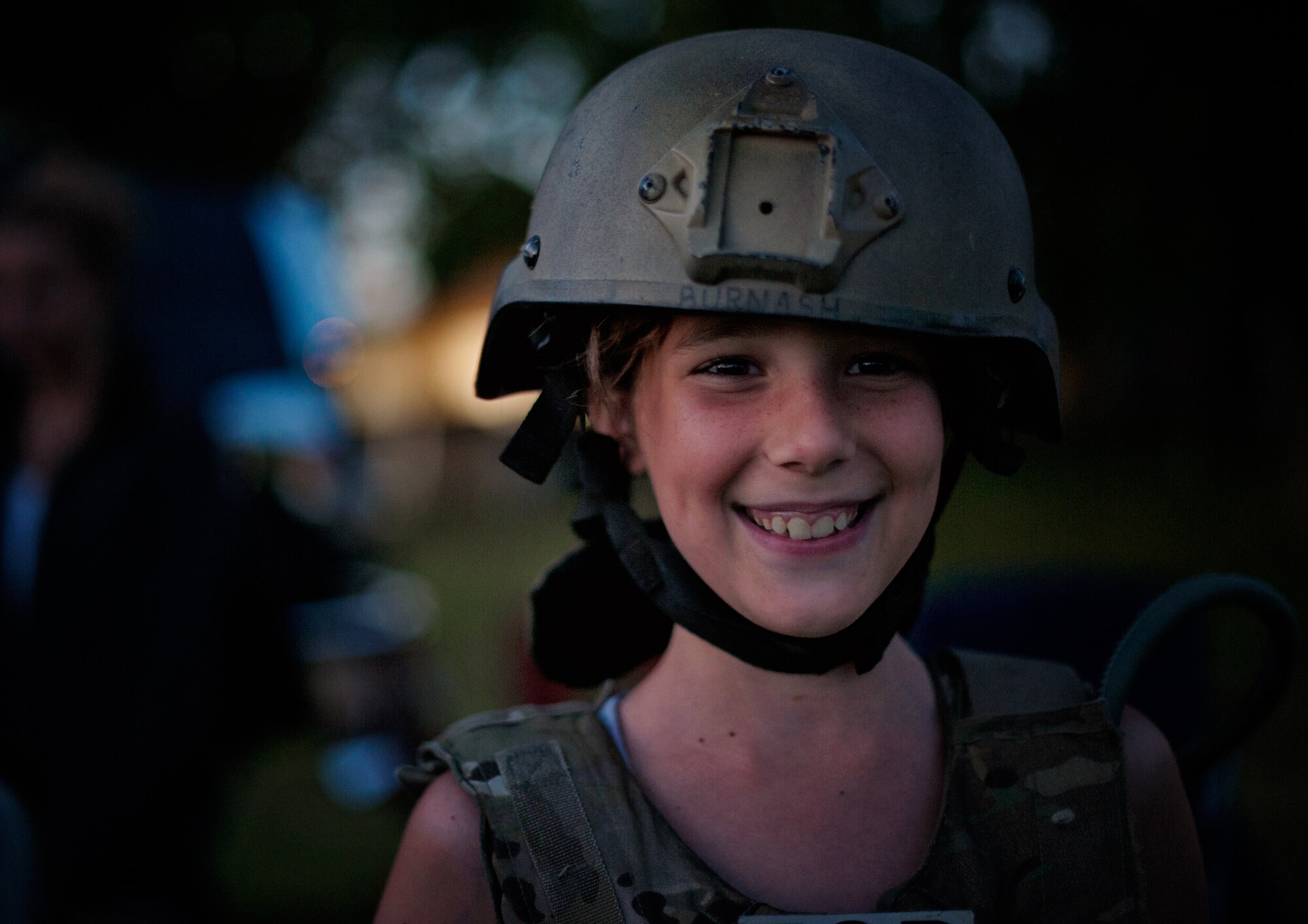 Izabelle King, 11-year-old daughter of Tech. Sgt. Chris and Dawn King wears a helmet during Joint Base McGuire-Dix-Lakehurst’s 2014 Independence Day Open House held at Doughboy Field, July 4, 2014. Attendees got hands-on experience with military equipment, view static displays and explosives ordnance disposal gear. (U.S. Air Force photo/Staff Sgt. Katherine Tereyama)
