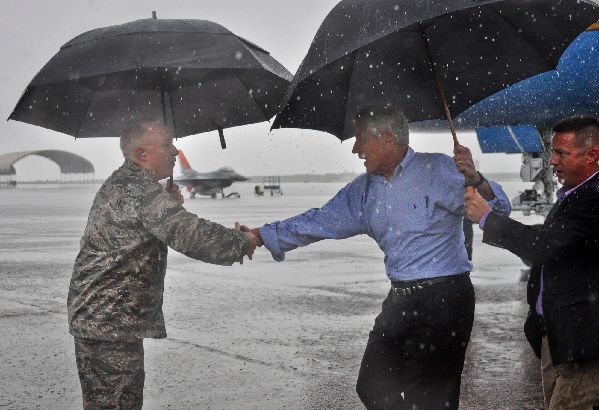 Defense Secretary Chuck Hagel greets Maj. Gen. Scott Jansson, the Armament Directorate program executive officer, upon arriving to Eglin Air Force Base, Fla., July 9.  Hagel visited the base to tour the 33rd Fighter Wing and F-35 Lightning II integrated training center.  He held a 45-minute troop call to praise the work of the service members who began and continue to improve the DOD’s newest fighter program.  (U.S. Air Force photo/Ilka Cole)