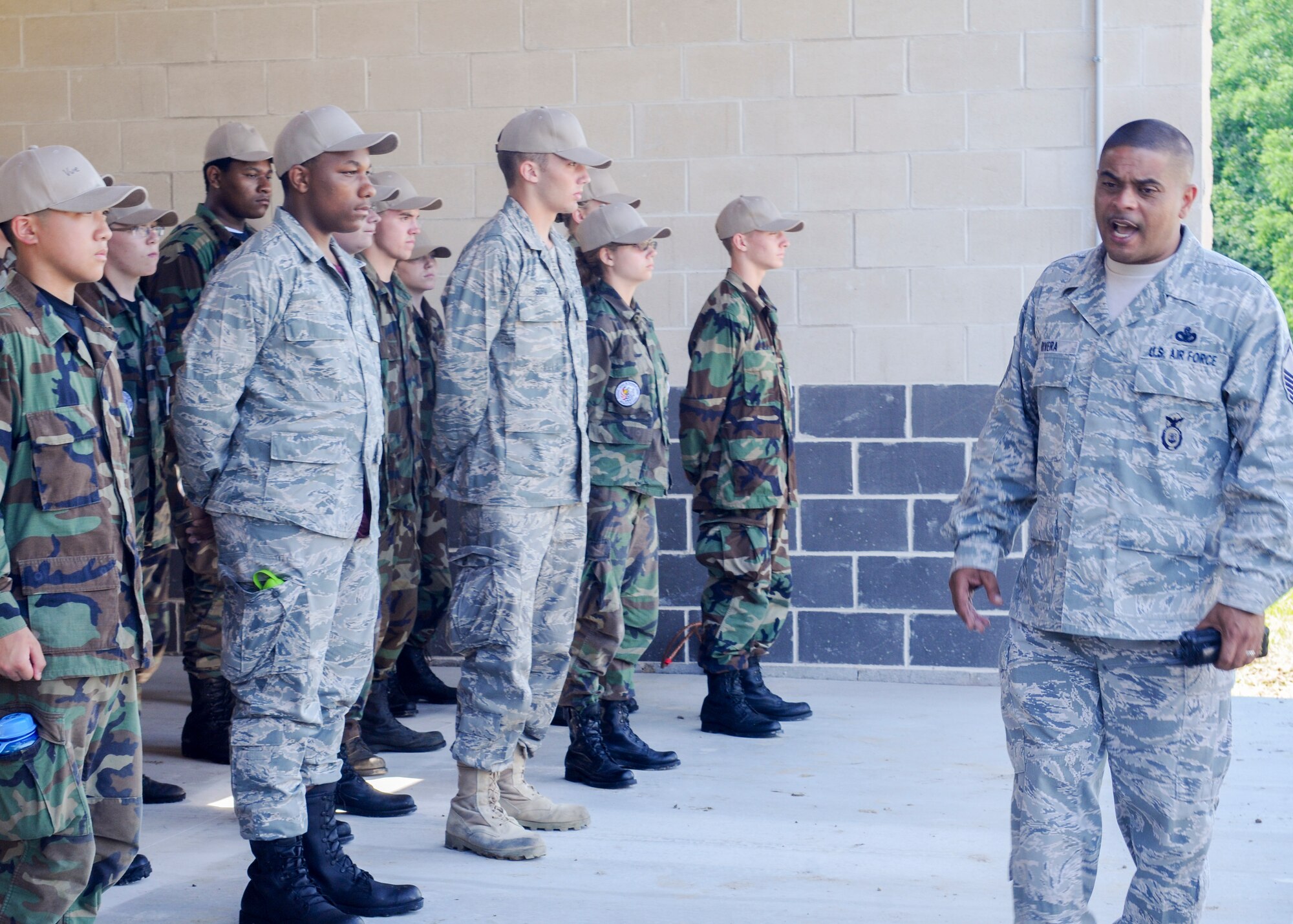 Master Sgt. Jose O. Rivera, an Operations Sergeant with the 910th Security Forces Squadron, briefs Junior Reserve Officer Training Corps (JROTC) cadets  at Camp Ravenna, Ohio, prior to entering a team-building obstacle course, June 27th, 2014. Approximately 30 JROTC cadets came to YARS for a four-day leadership development encampment facilitated by 910th Airlift Wing Airmen. U.S. Air Force photo/Eric M. White.