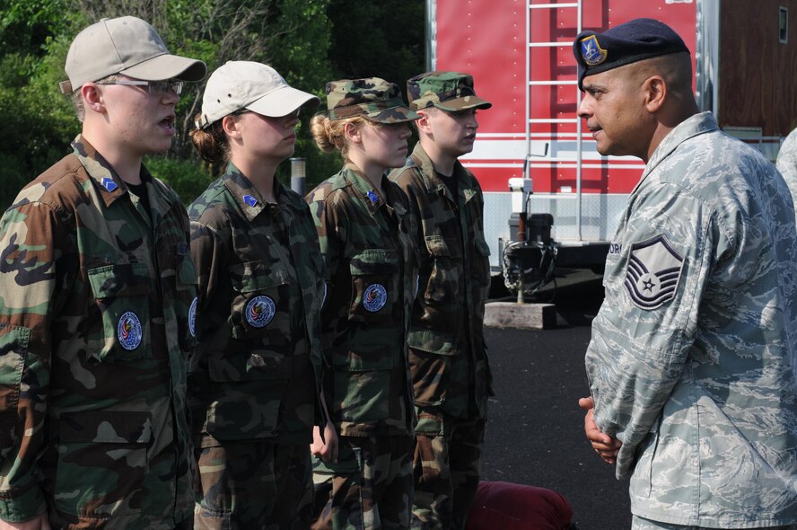 Master Sgt. Jose O. Rivera, an Operations Sergeant with the 910th Security Forces Squadron, questions Junior Reserve Officer Training Corps (JROTC) squad leaders upon their arrival to Youngstown Air Reserve Station (YARS), June 26th, 2014. Approximately 30 JROTC cadets came to YARS for a four-day leadership development encampment facilitated by 910th Airlift Wing Airmen. U.S. Air Force photo/Eric M. White.