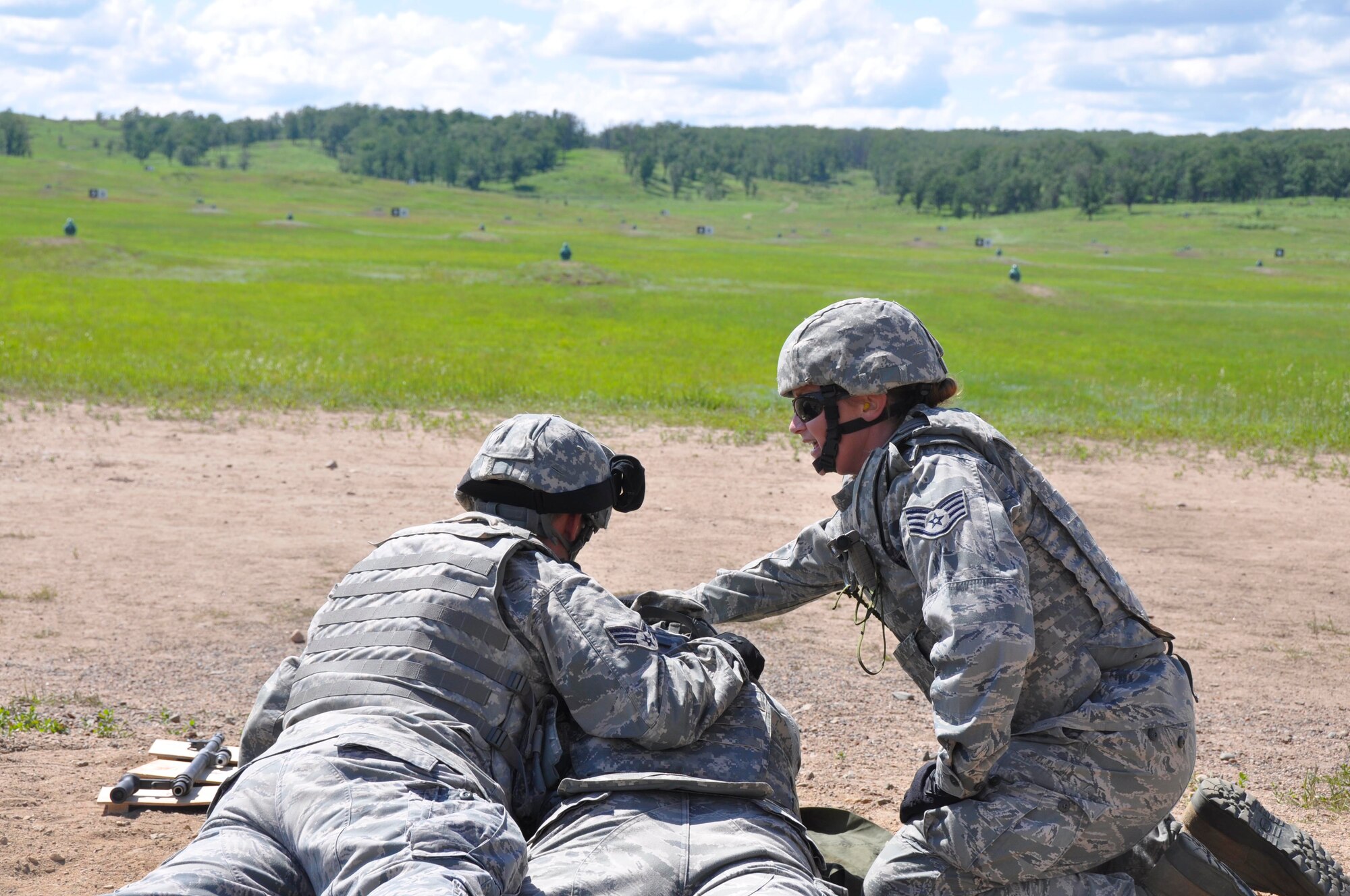 Staff Sgt. Nicole Lauby, 934th Security Forces Squadron, provides weapons instruction to fellow SFS members at Camp Ripley, Minn. (Air Force Photo/Master Sgt. Ronald Blackledge)