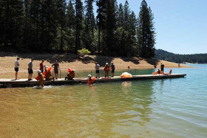 Survival, Evasion, Resistance, and Escape specialists train U-2 and MC-12 aircrew members on water survival July 3, 2014, at a lake in Nevada City, Calif. Water survival training educates aircrew members to properly use their survival equipment. (U.S. Air Force photo by Airman 1st Class Ramon A. Adelan/ Released) 