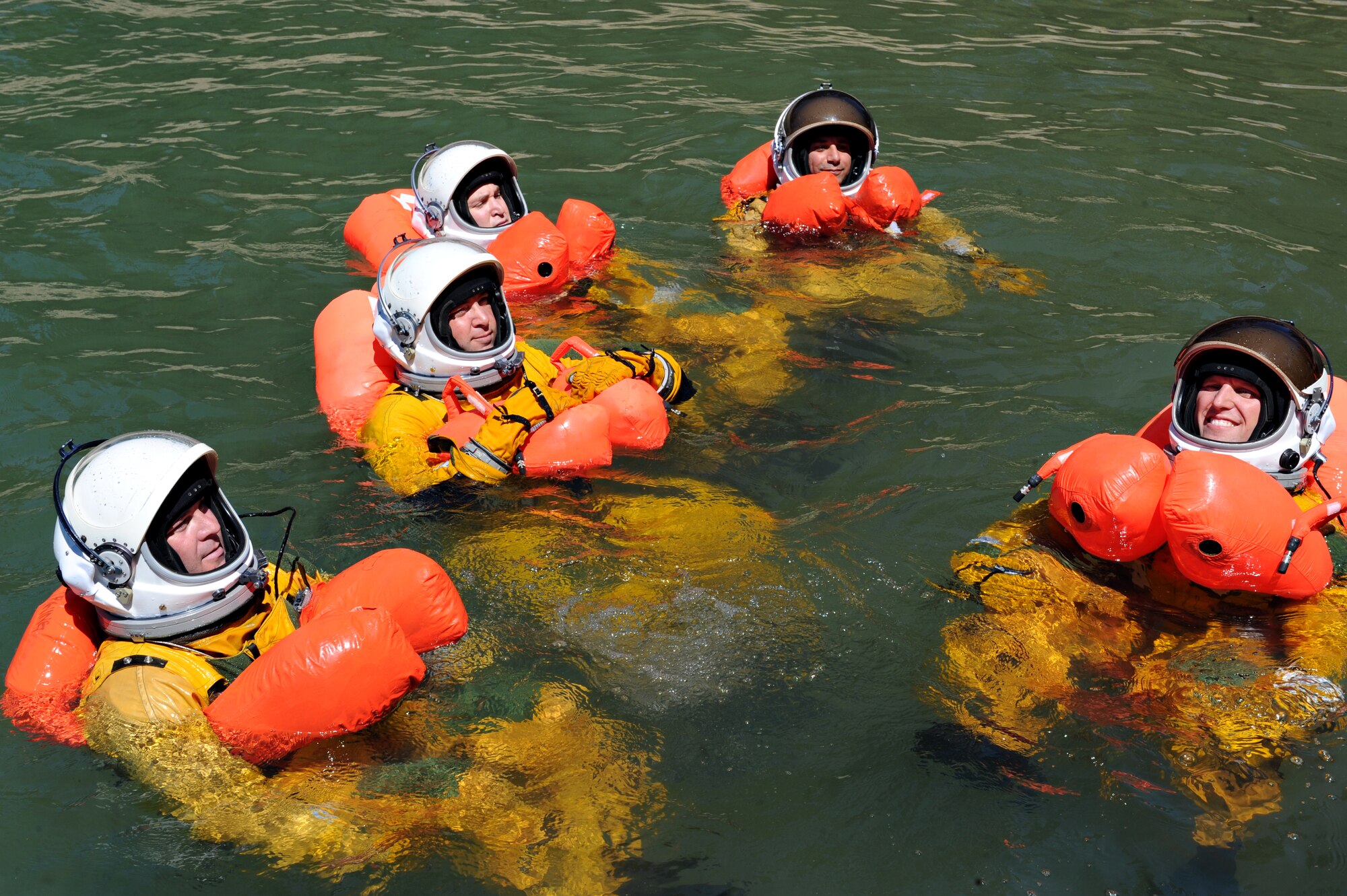 U-2 pilots use their floatation devices as part of water survival training July 3, 2014, at a lake in Nevada City, Calif. Survival, Evasion, Resistance, and Escape specialists stationed at Beale Air Force Base, Calif., educated the pilots about their water survival equipment. (U.S. Air Force photo by Airman 1st Class Ramon A. Adelan/ Released) 