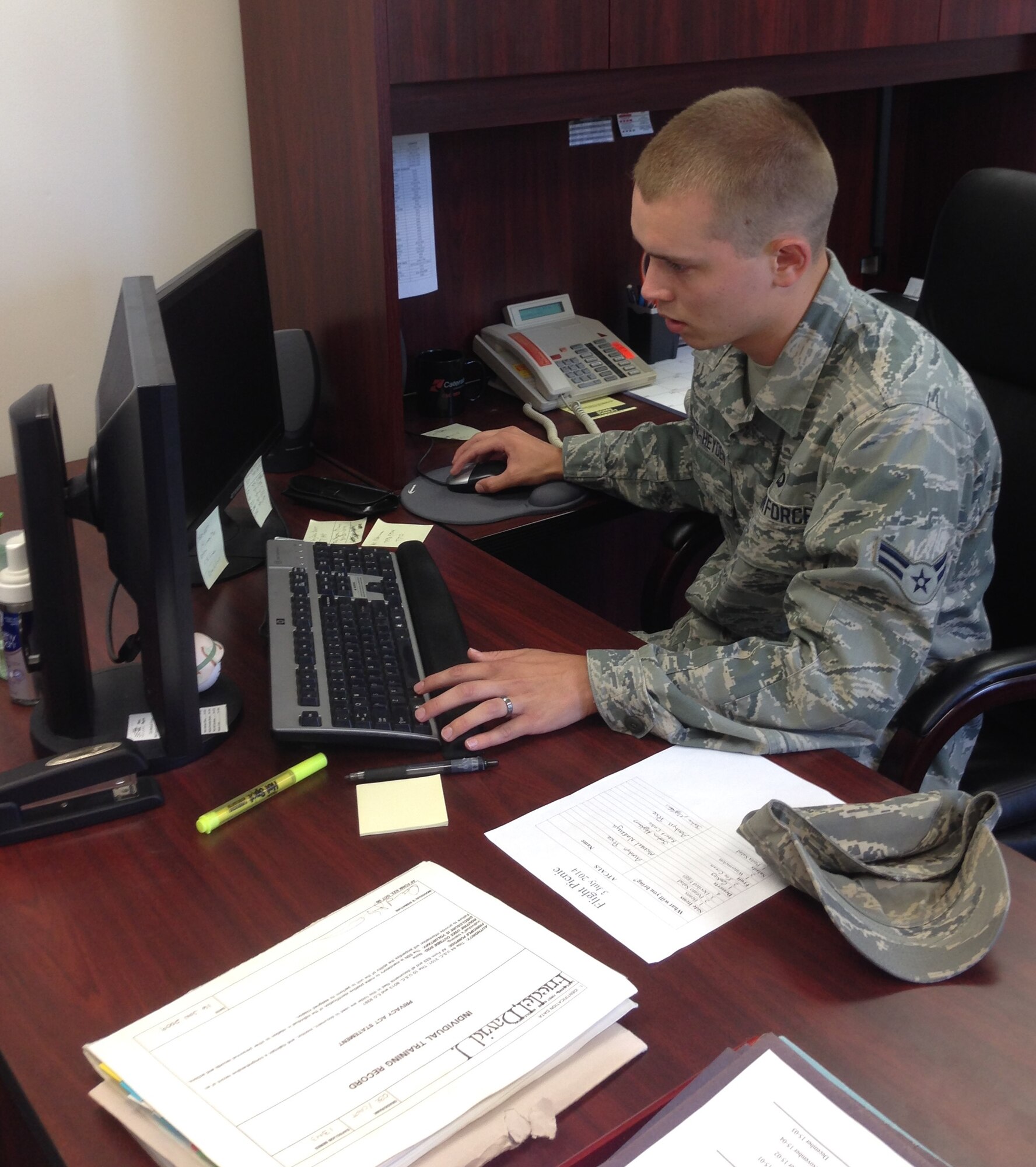 Airman 1st Class Joshua Vander-Heyden, 22nd Operations Support Squadron air traffic controller, reviews a warning before it is issued, July 1, 2014, at McConnell Air Force Base, Kan. Air traffic controllers maintain the airspace they’re assigned to through constant communication and tracking equipment and also issue warnings that could affect air traffic. (Courtesy photo)