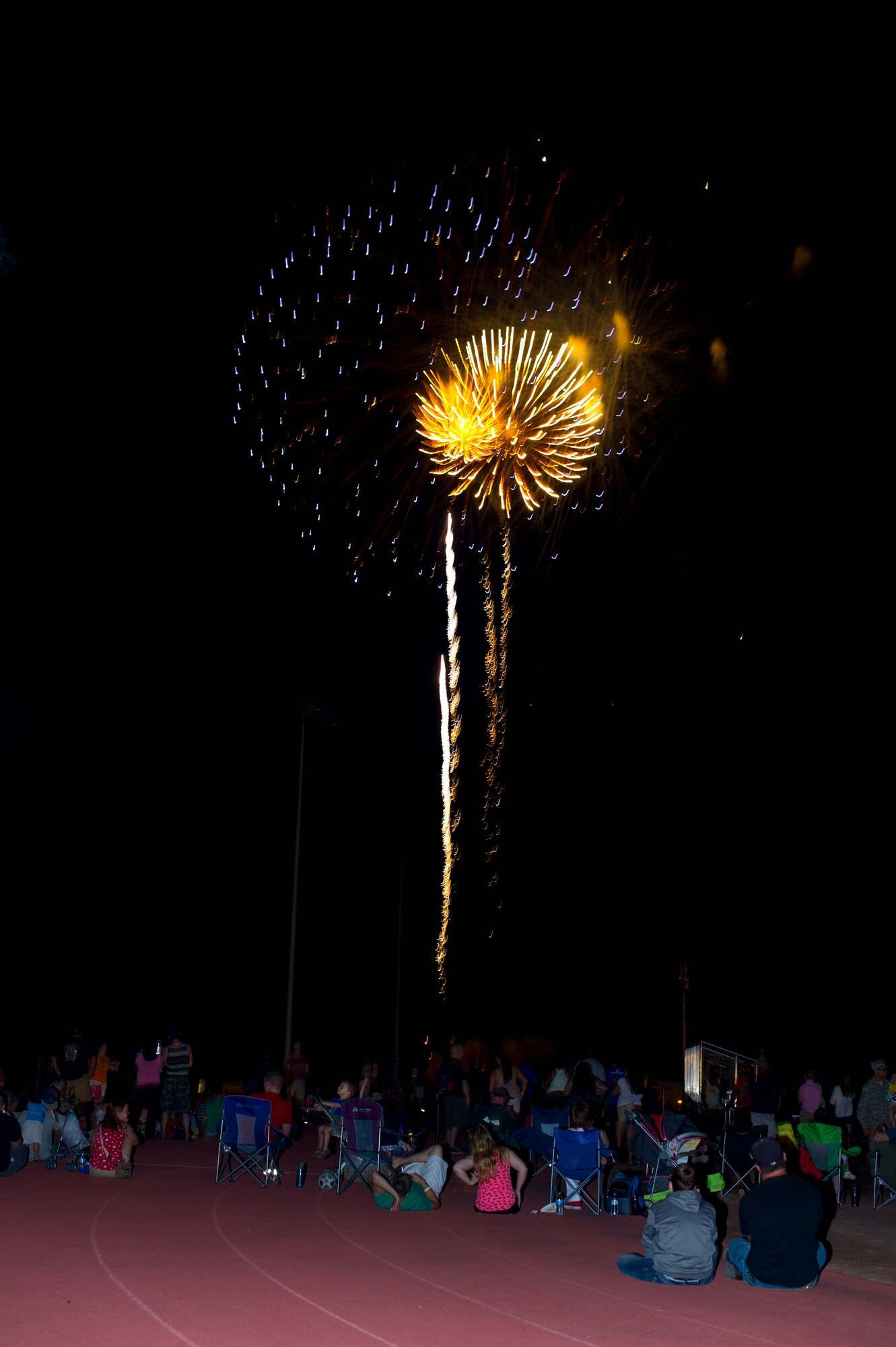 Fireworks are shot off during the Freedom Fest Independence Day celebration at Holloman Air Force Base, N.M., July 3. Freedom Fest took place in the Domenici Fitness and Sports Center parking lot and included carnival games, rides, and live music for Airmen and their families. (U.S. Air Force photo by Airman 1st Class Airman Aaron Montoya/Release)