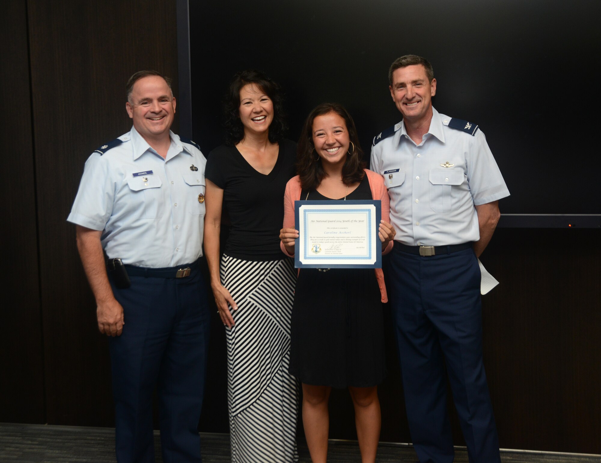 Col. Michael Flanagan, Air National Guard director of manpower, personnel and services, honors the Air National Guard 2014 Youth of the Year, Miss Caroline Ascherl with a certificate of recognition during a ceremony at the Air National Guard Readiness Center on Joint Base Andrews, Md., July 9, 2014. (U.S. Air National Guard photo by Senior Airman John E. Hillier/Released)
