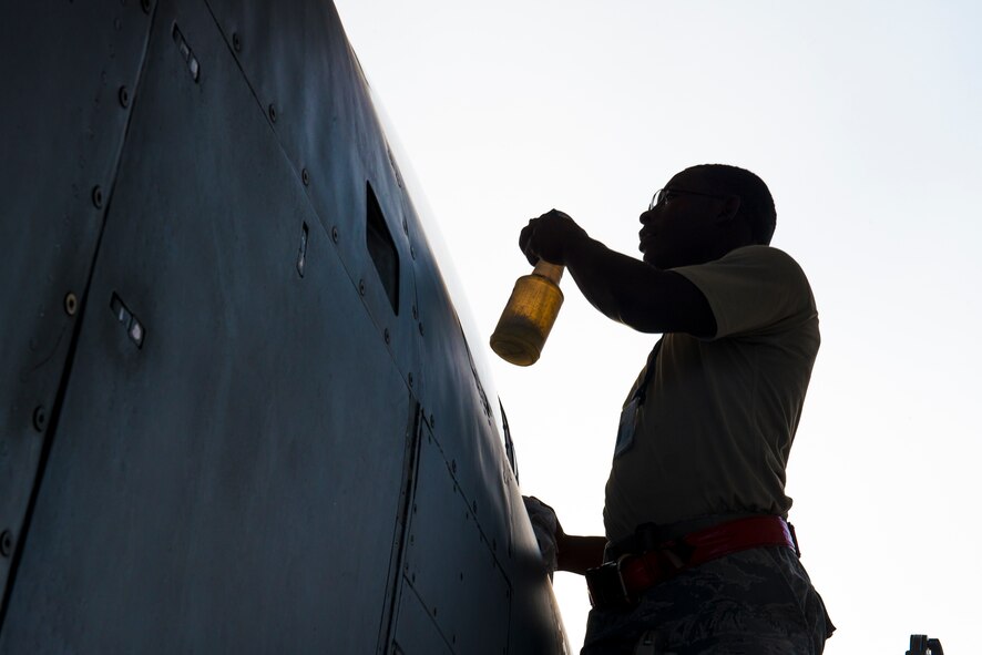 U.S. Air Force Airman 1st Class Kenyatta Turner, 23d Aircraft Maintenance Squadron crew chief, cleans an A-10C Thunderbolt II canopy at Moody Air Force Base, Ga., July 10, 2014. A canopy is the aircraft equivalent of a vehicle’s windshield and must be cleaned prior to each flight. (U.S. Air Force photo by Airman 1st Class Ryan Callaghan/Released)