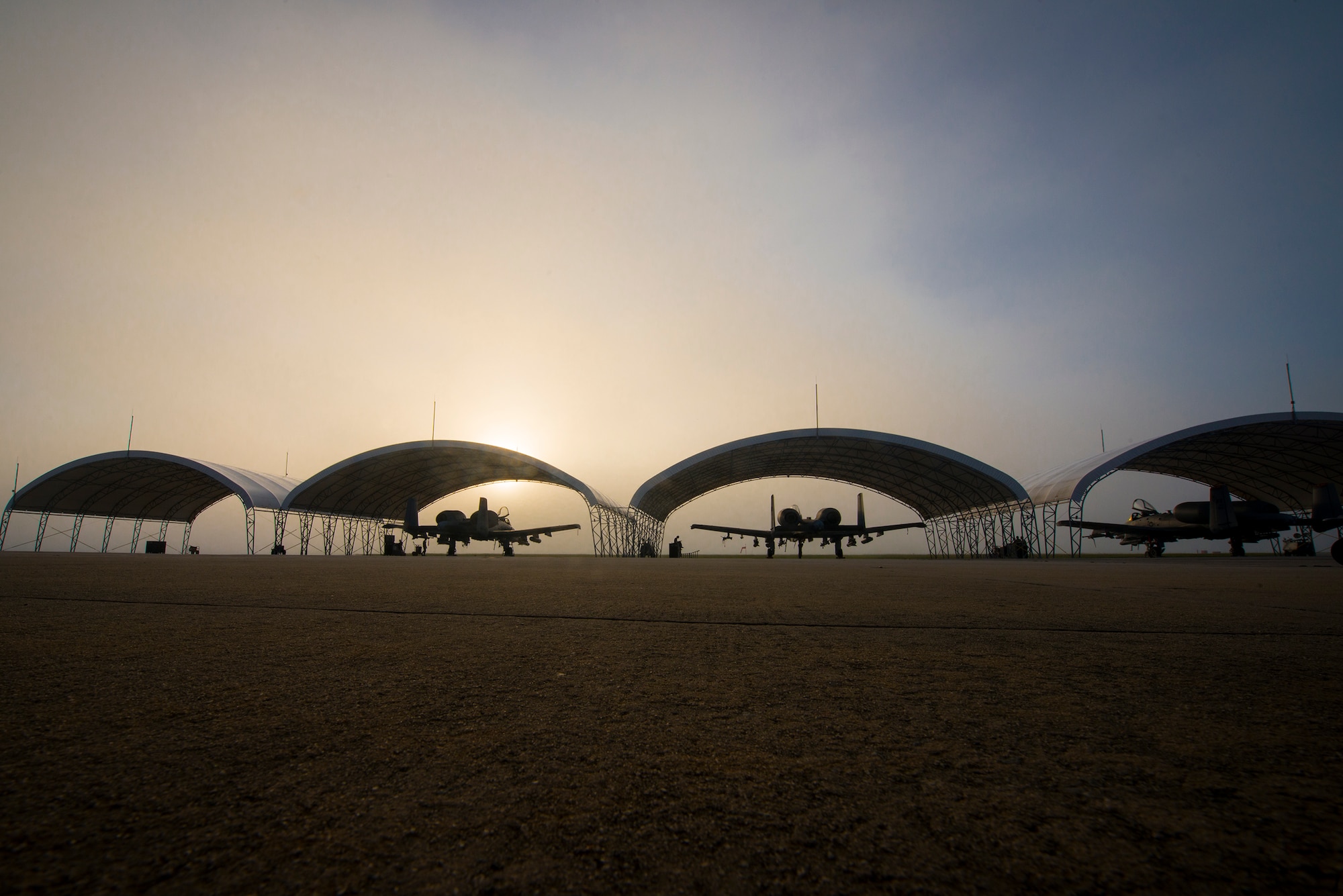 A row of A-10C Thunderbolt II aircraft sit under sun shades at Moody Air Force Base, Ga., July 10, 2014. Airmen from the 23d Aircraft Maintenance Squadron work around the clock to ensure Moody’s A-10 fleet is mission ready at a moment’s notice. (U.S. Air Force photo by Airman 1st Class Ryan Callaghan/Released)