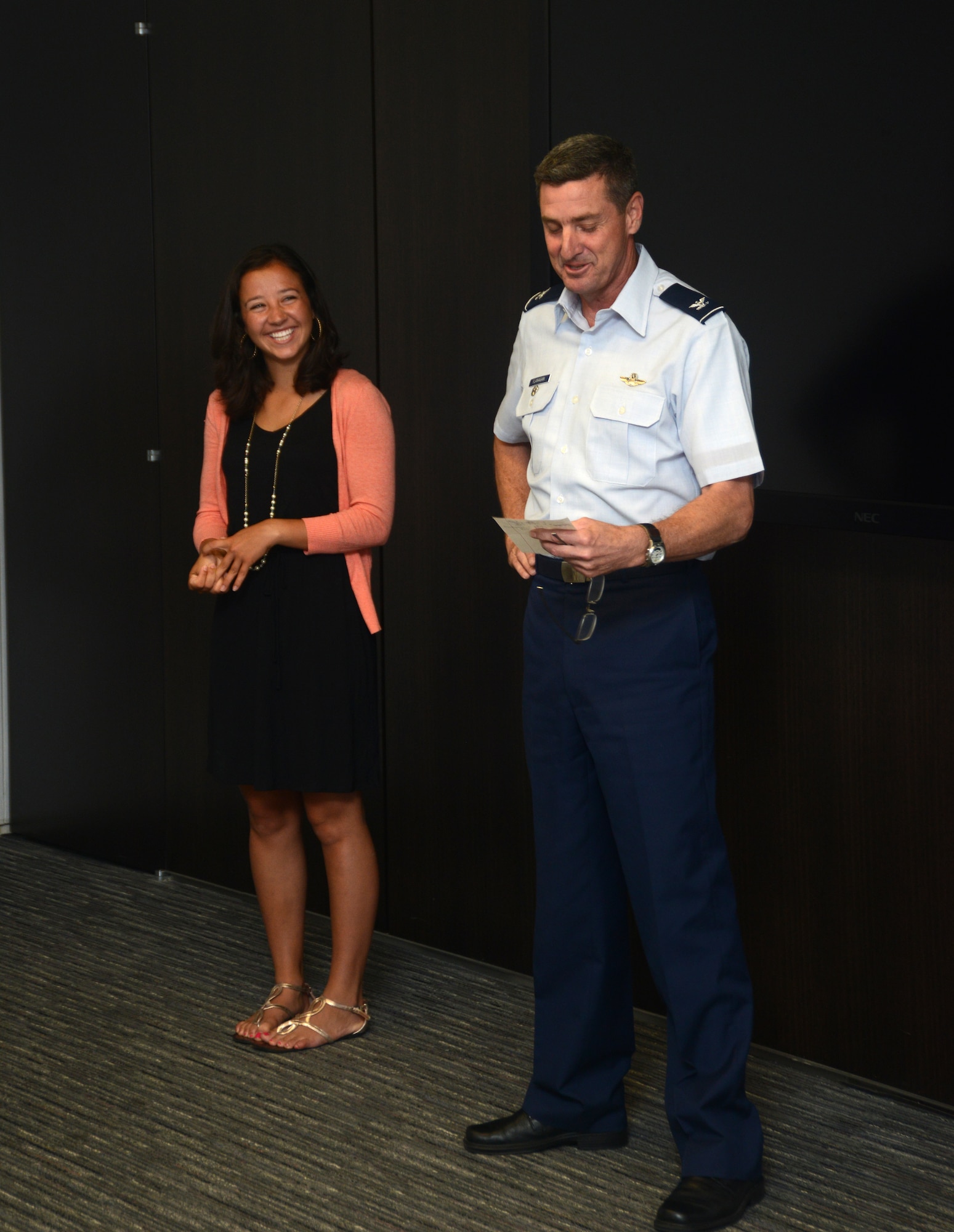 Col. Michael Flanagan, Air National Guard director of manpower, personnel and services, honors the Air National Guard 2014 Youth of the Year, Miss Caroline Ascherl during a ceremony at the Air National Guard Readiness Center on Joint Base Andrews, Md., July 9, 2014. (U.S. Air National Guard photo by Senior Airman John E. Hillier/Released)