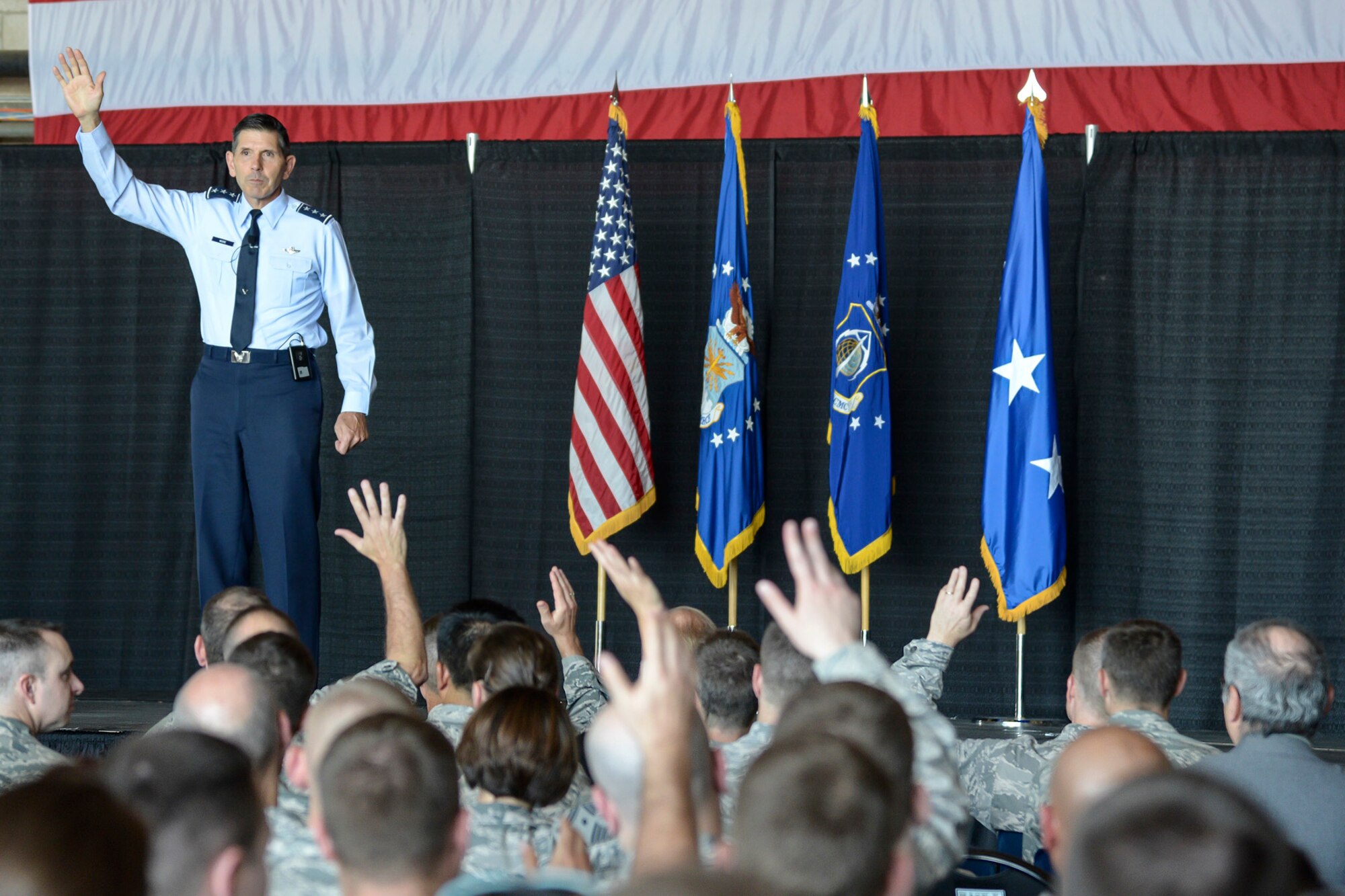 HANSCOM AIR FORCE BASE, Mass. -- Lt. Gen. C. D. Moore II, Air Force Life Cycle Management Center commander, addresses members of the Hanscom community inside the Aero Club Hangar during an all-call here July 9. Moore highlighted the multitude of successes achieved by members of the 66th Air Base Group, Contracting, Battle Management and Command, Control, Communications, Intelligence and Networks Directorates. (U.S. Air Force Photo by Walter Santos)