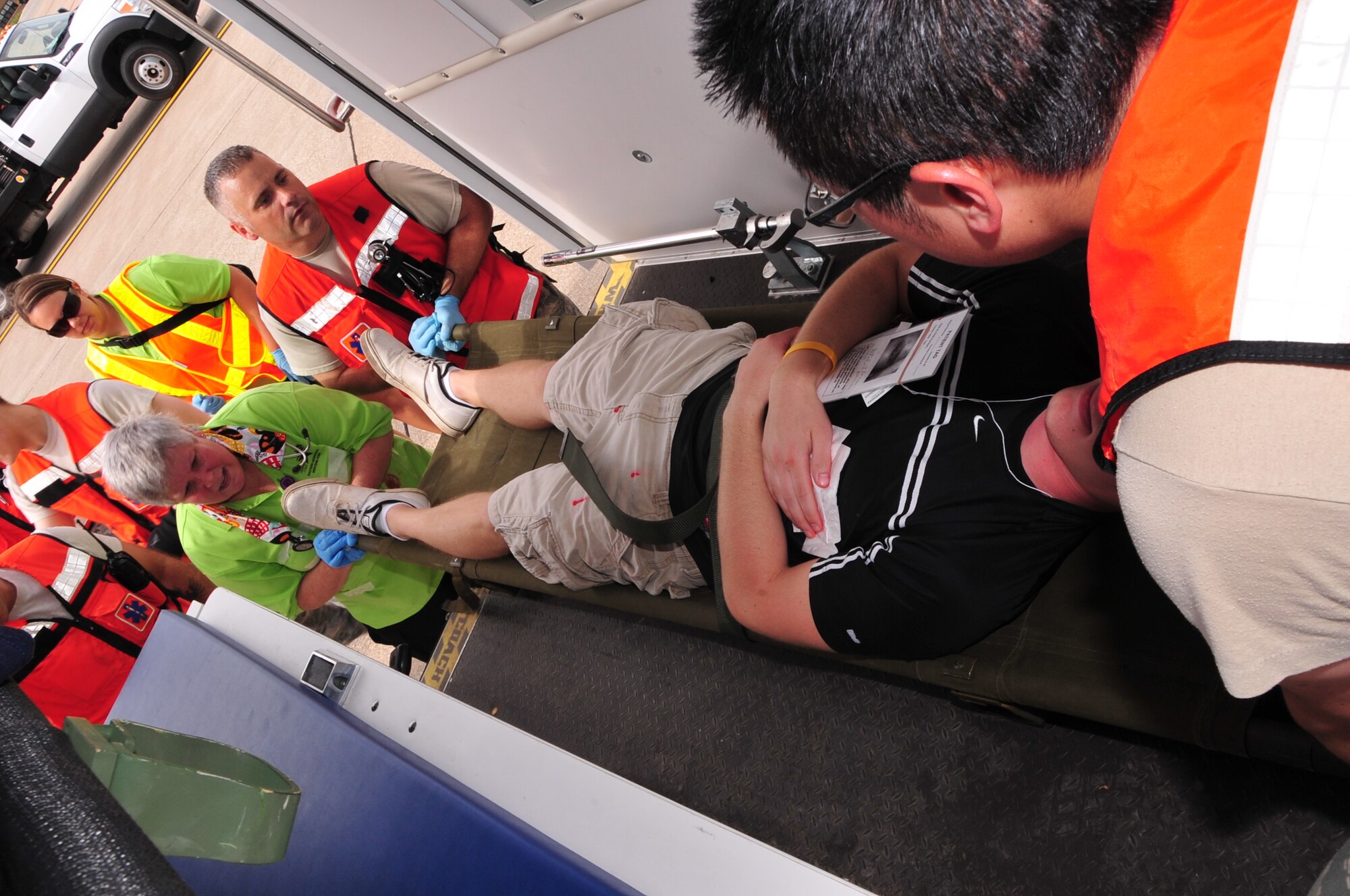 First responders from Offutt Air Force Base, Nebraska, and Bellevue load a victim into an ambulance during the Major Accident Response Exercise at Offutt Air Force Base, Nebraska, June 28. The MARE is an annual exercise used to prepare and train units on base as well as the surrounding community on how to respond to a major incident if it was to happen during an air show. (U.S. Air Force photo by D.P. Heard/Released)
