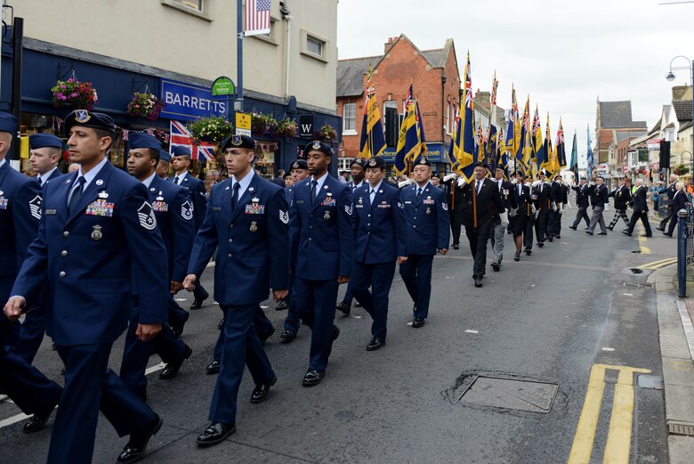 Airmen from the 423rd Air Base Group march through the streets of St. Neots, United Kingdom, during the Freedom of the Town and Armed Forces Day celebration, July 5, 2014. The festival honored past and present Service members from the United States and United Kingdom. (U.S. Air Force photo by Tech. Sgt. Chrissy Best/Released)