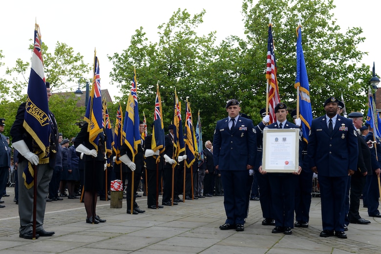 Airmen from the 423rd Air Base Group prepare to march through the streets of St. Neots, United Kingdom, during the Freedom of the Town and Armed Forces Day celebration, July 5, 2014. The festival marked the first time St. Neots presented the freedom of the town scroll to an entire U.S. military unit. (U.S. Air Force photo by Tech. Sgt. Chrissy Best/Released)