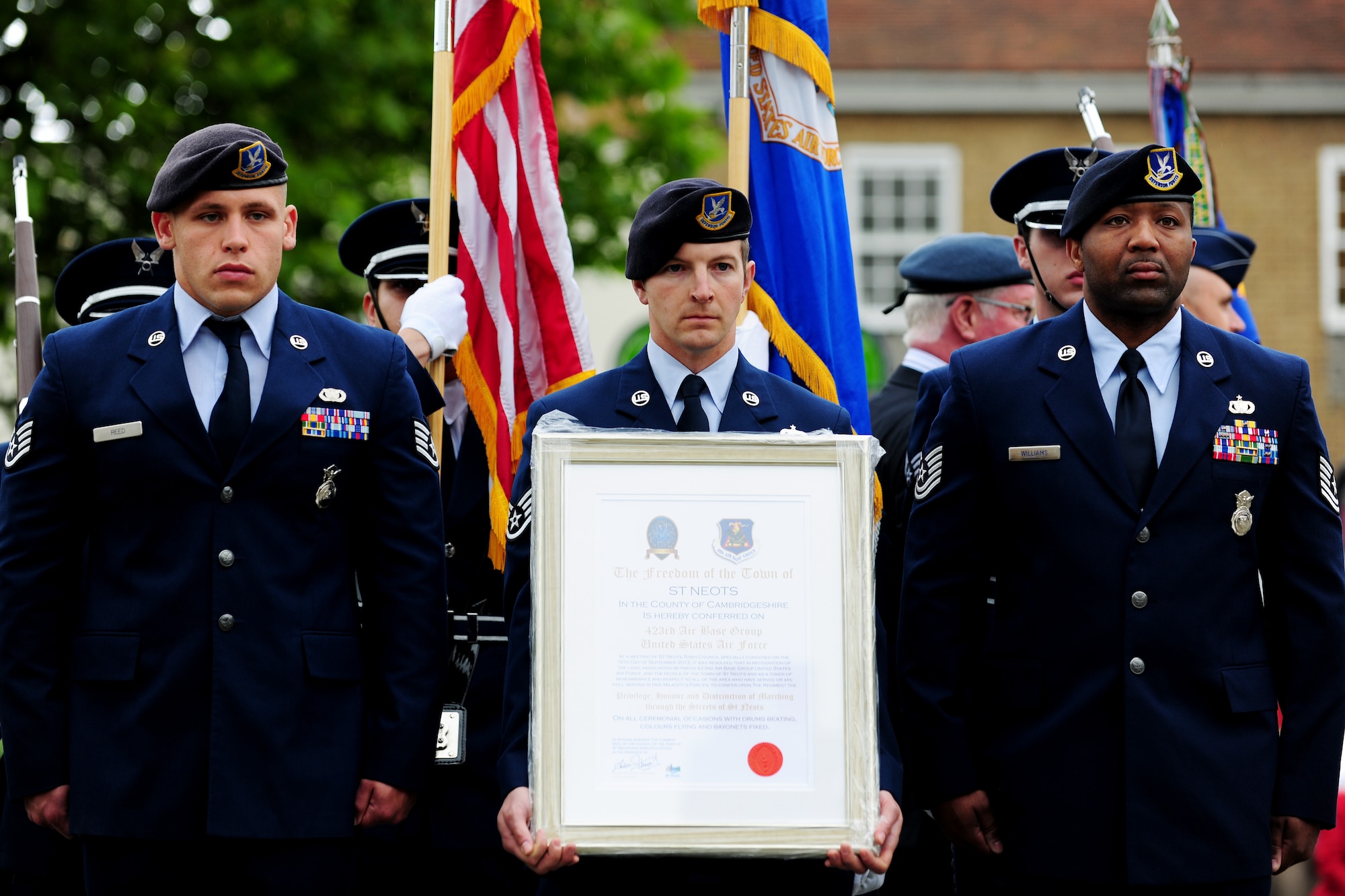 Staff Sgt. Anthony McDaniel, from the 423rd Security Forces Squadron, holds the scroll granting the U.S. Air Force permission to march through St. Neots, United Kingdom during the Freedom of the Town and Armed Forces Day celebration, July 5, 2014. The festival marked the first time St. Neots  presented the freedom of the town scroll to an entire U.S. military unit. (U.S. Air Force photo by Staff Sgt. Jarad A. Denton/Released)