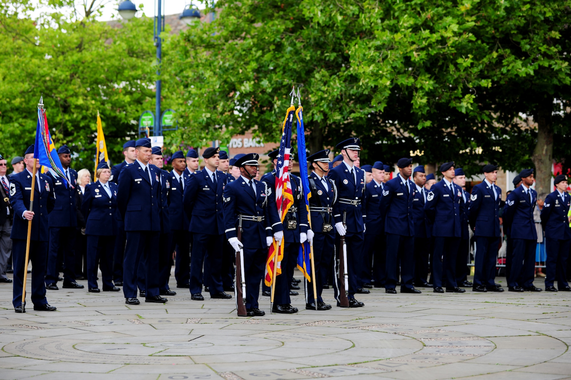 Airmen from the 423rd Air Base Group stand during the Freedom of the Town and Armed Forces Day at St. Neots, United Kingdom, July 5, 2014. The festival marked the first time St. Neots presented the freedom of the town scroll to an entire U.S. military unit. (U.S. Air Force photo by Staff Sgt. Jarad A. Denton/Released)