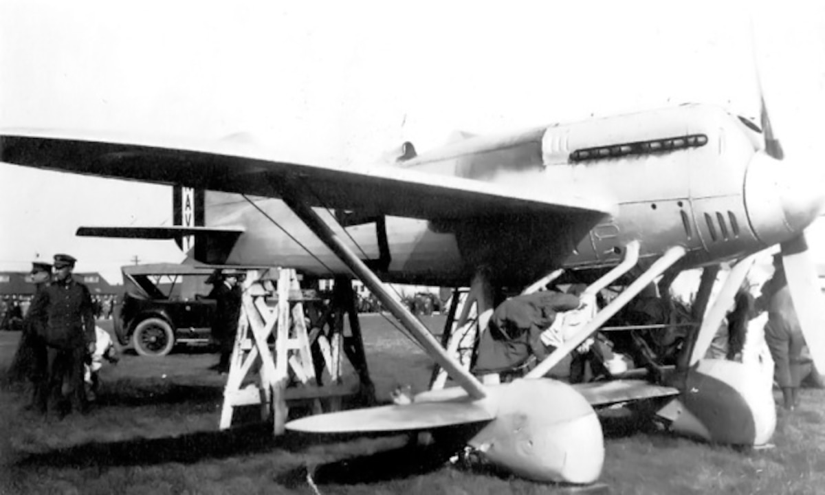 The Navy-Wright NW-1 (A-6543) with race number 9 at Selfridge Field for the 1922 Pulitzer Race. Note that the engine cowling covers the engine cylinder banks. The image illustrates the limited ground clearance of the wheel fairings. (U.S. Navy photo)