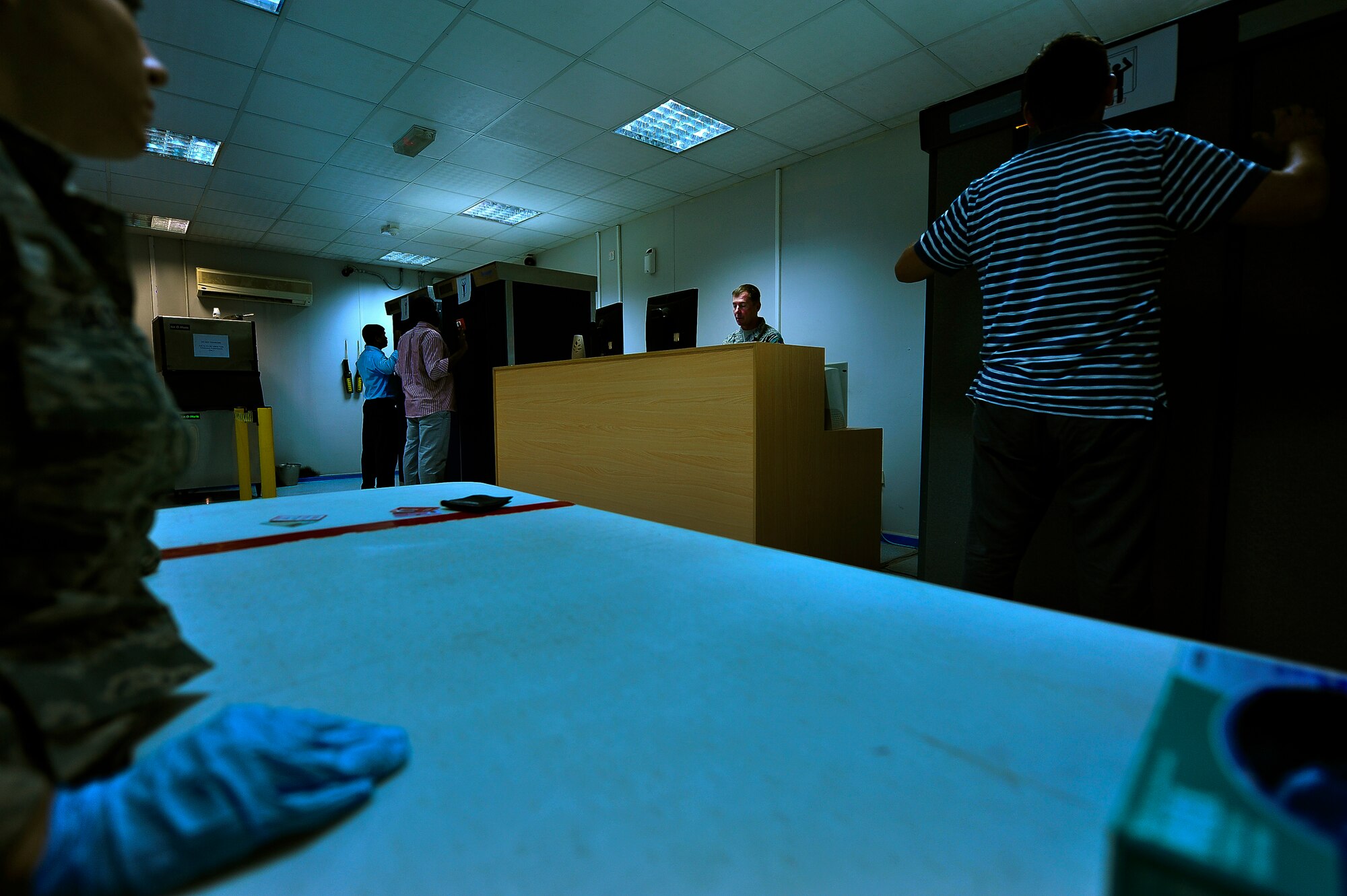 Staff Sgt. Ronald Ball conducts security screening June 26, 2014, at an undisclosed location in Southwest Asia. Ball brings an extensive background in criminal justice to his duties overseeing the interviews and investigations of contraband violators.  (U.S. Air Force photo by Tech. Sgt. Russ Scalf/Released)