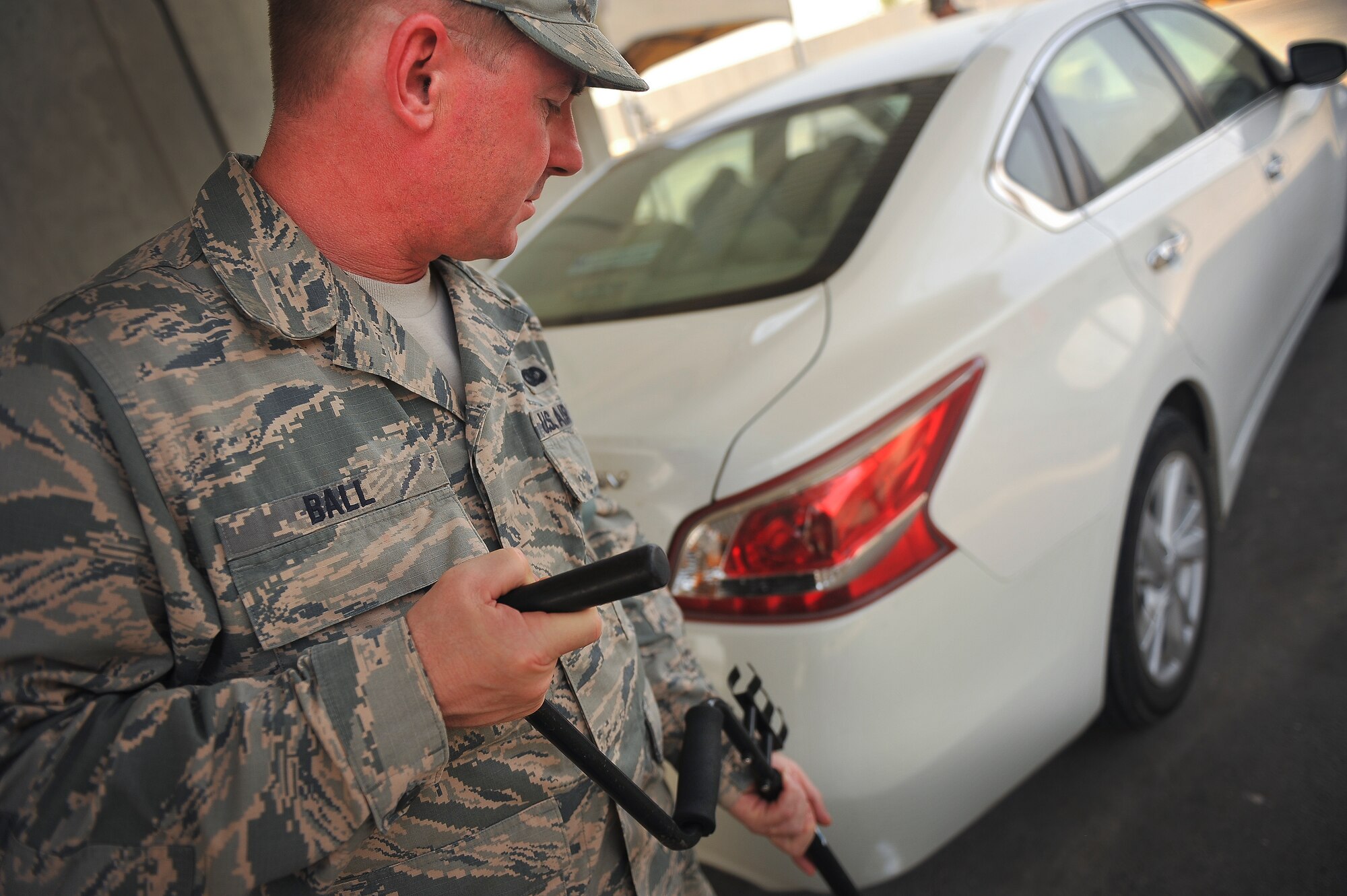 Staff Sgt. Ronald Ball, 380th Expeditionary Security Forces, performs a security check on a vehicle June 25, 2014, at an undisclosed location in Southwest Asia. Ball, 50, was recently promoted to the rank of Staff Sgt. during his deployment to Southwest Asia.  (U.S. Air Force photo by Tech. Sgt. Russ Scalf/Released)