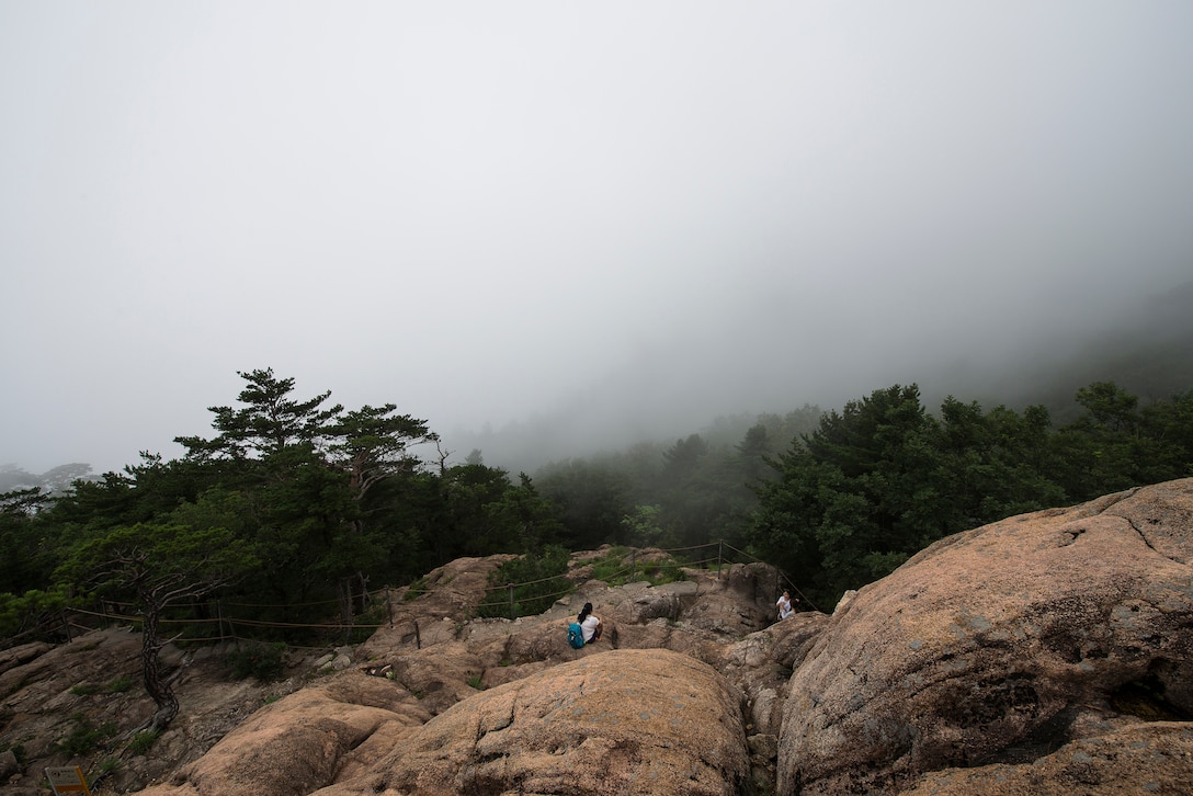 A view from the top of a mountain peak at Seoraksan National Park July 5, 2014, in Sokcho, Republic of Korea. Seoraksan National Park is one of the major parks in South Korea, encompassing more than 100 kilometers of land and numerous mountain peaks. (U.S. Air Force photo by Staff Sgt. Jake Barreiro)