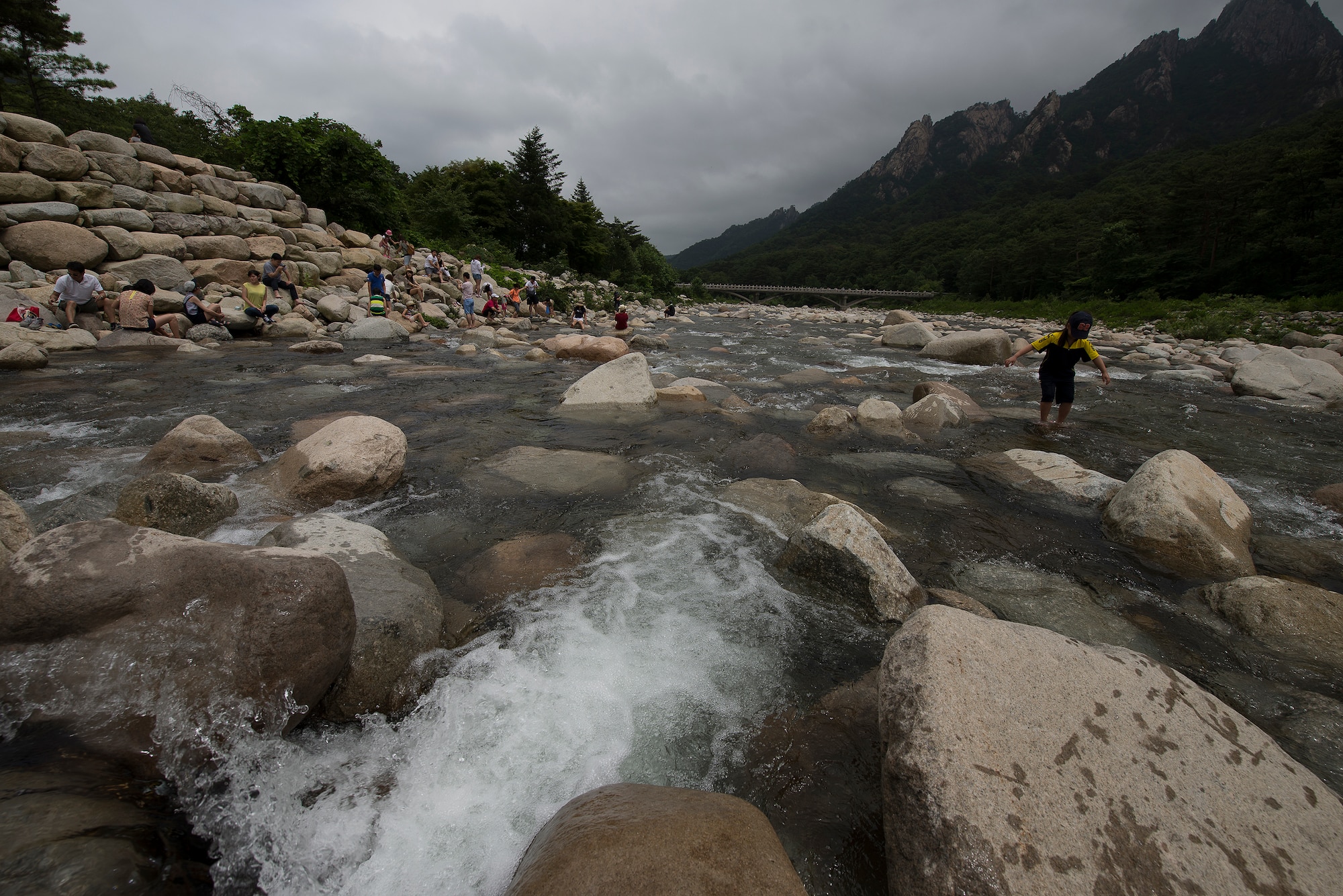 People play in the river in Seoraksan National Park July 5, 2014, in Sokcho, Republic of Korea. Seoraksan National Park is one of the major forest and ecological preserves in South Korea. (U.S. Air Force photo by Staff Sgt. Jake Barreiro)