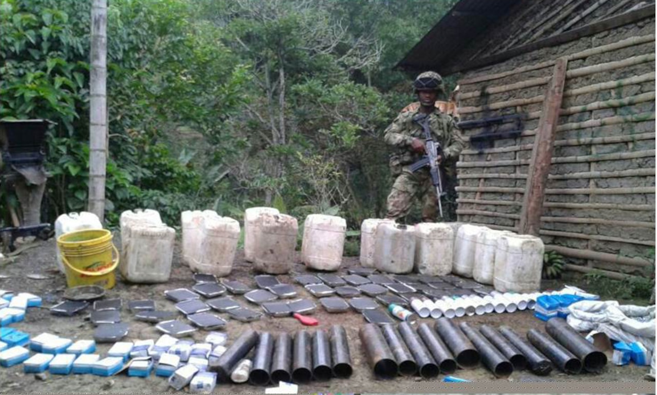 A Colombian soldier displays artifacts seized during a raid of an improvised explosive device factory that belonged to the Revolutionary Armed Forces of Colombia. Colombian authorities say about 75 percent of the casualty events affecting Colombian troops are related to IED incidents. Colombian army photo