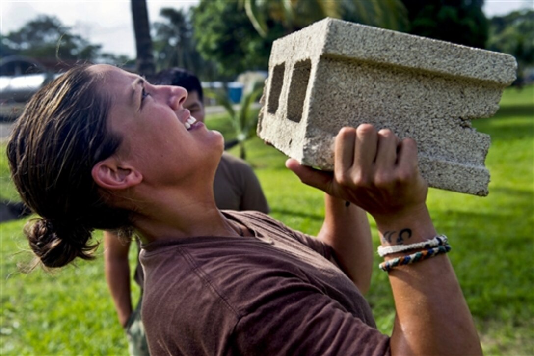 U.S. Navy Petty Officer 2nd Class Catalina Logo trains for combat conditioning for the U.S. Marine Corps martial arts program during Southern Partnership Station 2014 in Punta Gorda, Belize, July 1, 2014. Southern Partnership Station is a U.S. Navy deployment focused on subject matter expert exchanges with partner nation militaries and security forces. 