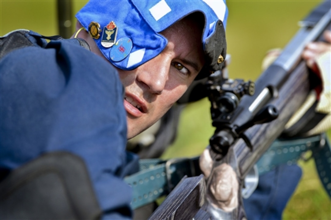 Marine Corps Capt. Trevor Hengehold prepares to shoot during the 2014 Interservice Rifle Competition on Quantico Marine Base, Va., July 8, 2014. Hengehold is a marksman with Marine Force Command. Marksmen from throughout the Defense Department competed, including members of the Marine Corps Shooting Team, the Army Marksmanship Unit, the South Carolina Guard, the Navy Shooting Team, the National Guard Shooting Team and the Army Reserve Shooting Team. 