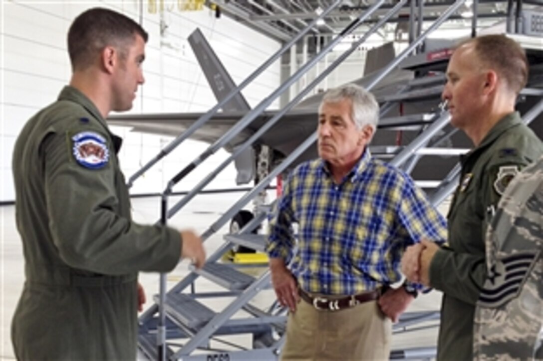 Defense Secretary Chuck Hagel speaks with two F-35A Lightning II crew members during his visit to Eglin Air Force Base, Fla., July 10, 2014, during a two-day trip to visit bases in the South.