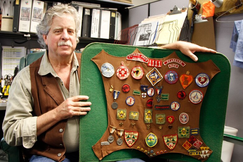 The Charleston District has nine Eagle Scouts in our approximately 250 employees. Each of these Eagle Scouts has a different story about their experience. Here, Paul Hinchcliff shows off his collection of badges and medals he earned while in Scouts.