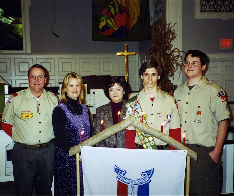 The Charleston District has nine Eagle Scouts in our approximately 250 employees. Each of these Eagle Scouts has a different story about their experience. Here, Chris Mims (second from right) stands with his family at his Eagle ceremony.