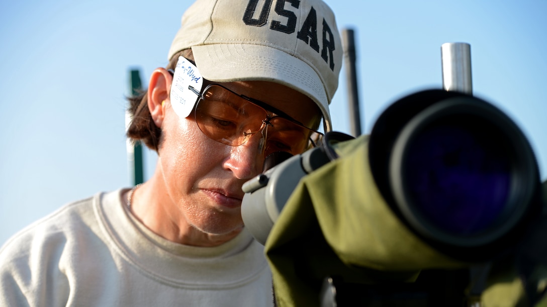 Col. Denise Loring checks a competitor’s shot through a scope during the 53rd Annual Interservice Rifle Championship at Marine Corps Base Quantico, Virginia, July 7, 2014. The best shooters from all services are selected and earn their way to participate in competitions. Loring is a reservist officer with the Office of the Secretary of Defense.