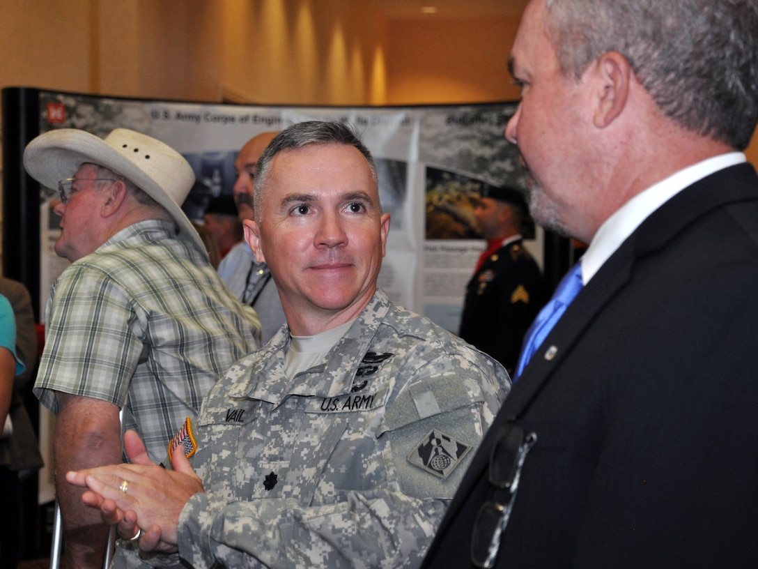 Lt. Col. Timothy R. Vail, new commander of the U.S. Army Corps of Engineers' Walla Walla District, talk with his Executive Assistant Jeff Jackson after the change-of-command ceremony,  held in Walla Walla, Wash., on July 11.