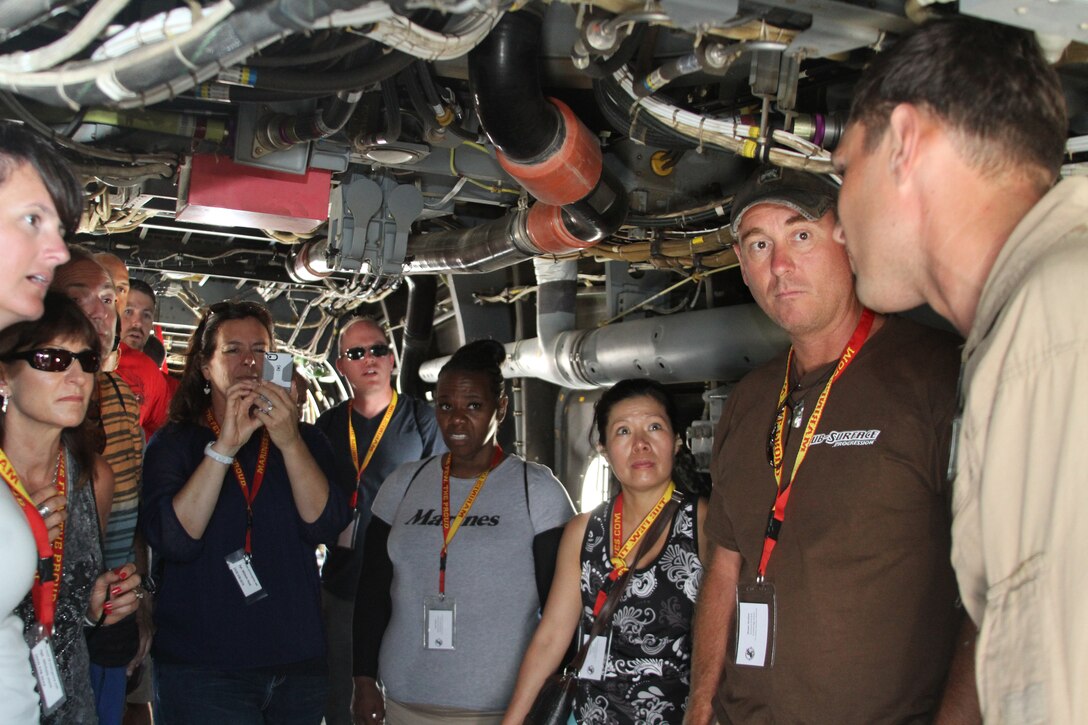 MARINE CORPS AIR STATION MIRAMAR, Calif. - Educators and community influencers from Recruiting Station Los Angeles and RS Sacramento learn about and get an up-close view of various aircraft as part of an Educators’ Workshop here, July 9, 2014. The educators and community leaders are given the chance to learn about the transition from civilian to Marine and what is expected of a Marine on a day-to-day basis to better understand what the Marine Corps can offer for a transitioning young man or woman. (Official U.S. Marine Corps Photo by Sgt. Erika Kirsop)