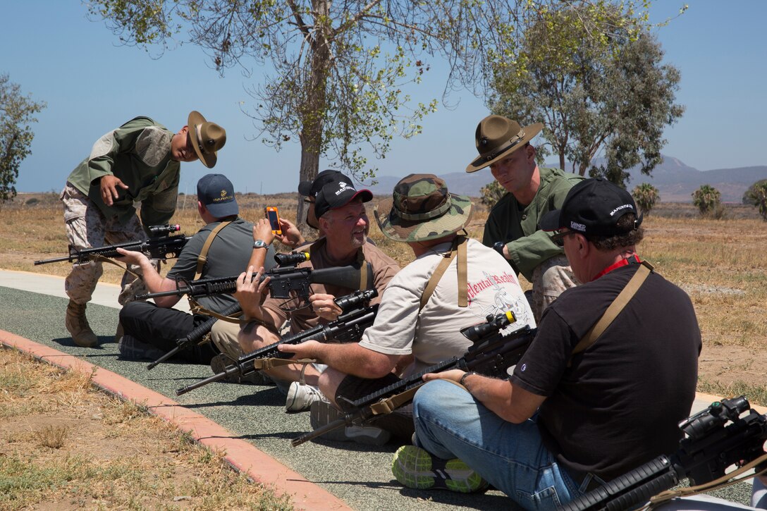 CAMP PENDELTON, Calif. - Educators from Recruiting Station Los Angeles and RS Sacramento learn about basic marksman ship with the M16A4 service rifle at Edson Range as part of an Educators’ Workshop here, July 10, 2014. The educators and community leaders are given the chance to learn about the transition from civilian to Marine and what is expected of a Marine on a day-to-day basis to better understand what the Marine Corps can offer for a transitioning young man or woman. (Official U.S. Marine Corps Photo by Sgt. Rebecca Eller)