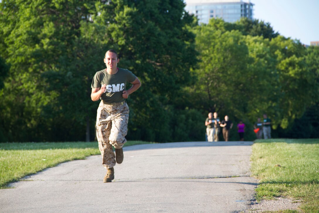Candidate Lauren Glomski enters the final stretch of the movement to contact portion of the Combat Fitness Test at Veterans Park in Milwaukee, Wis., July 10, 2014.  Officer Selection Station Milwaukee conducted a Combat Fitness Test to help prepare their officer candidates and applicants for Officer Candidates School.