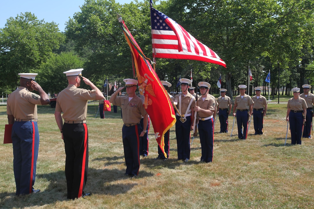 Col. J. J. Dill, the former commanding officer of 1st Marine Corps District, salutes during the National Anthem at his change of command and retirement ceremony on Naval Weapons Station Earle, July 11. Dill has retired from the Marine Corps after more than 24 years of faithful service. (U.S. Marine Corps photo by Lance Cpl. Brandon Thomas).