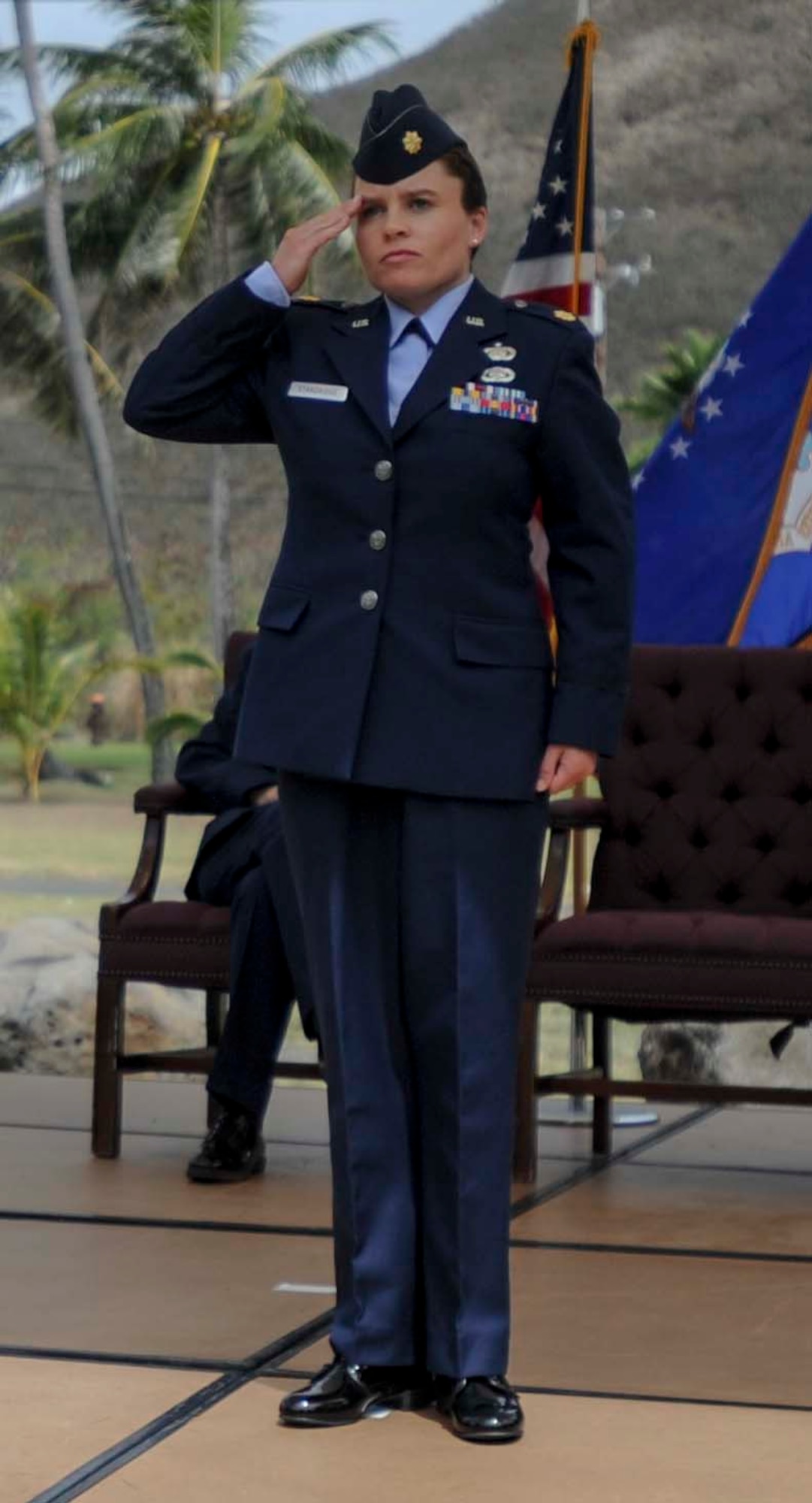 Maj. Dawn Standridge, Detachment 2, 18th Force Support Squadron commander, renders her first salute as commander during a change of command ceremony at Bellows Air Force station, Hawaii, July 11, 2014. During the ceremony, Standridge took command of the squadron from Maj. Tony Cambron. (U.S. Air Force photo by Tech. Sgt. Terri Paden)