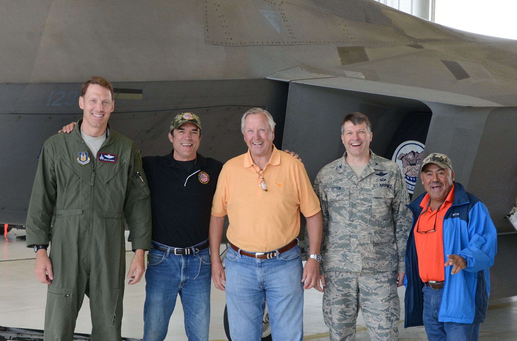 Col. David Piffarerio, John Yenason, James Thomason, Col. Tyler Otten and Abel Narezo pose for a picture after getting a tour of the 302nd Fighter Squadron and the F-22 here July 11. (U.S. Air Force photo/ Tech. Sgt. Dana Rosso) 